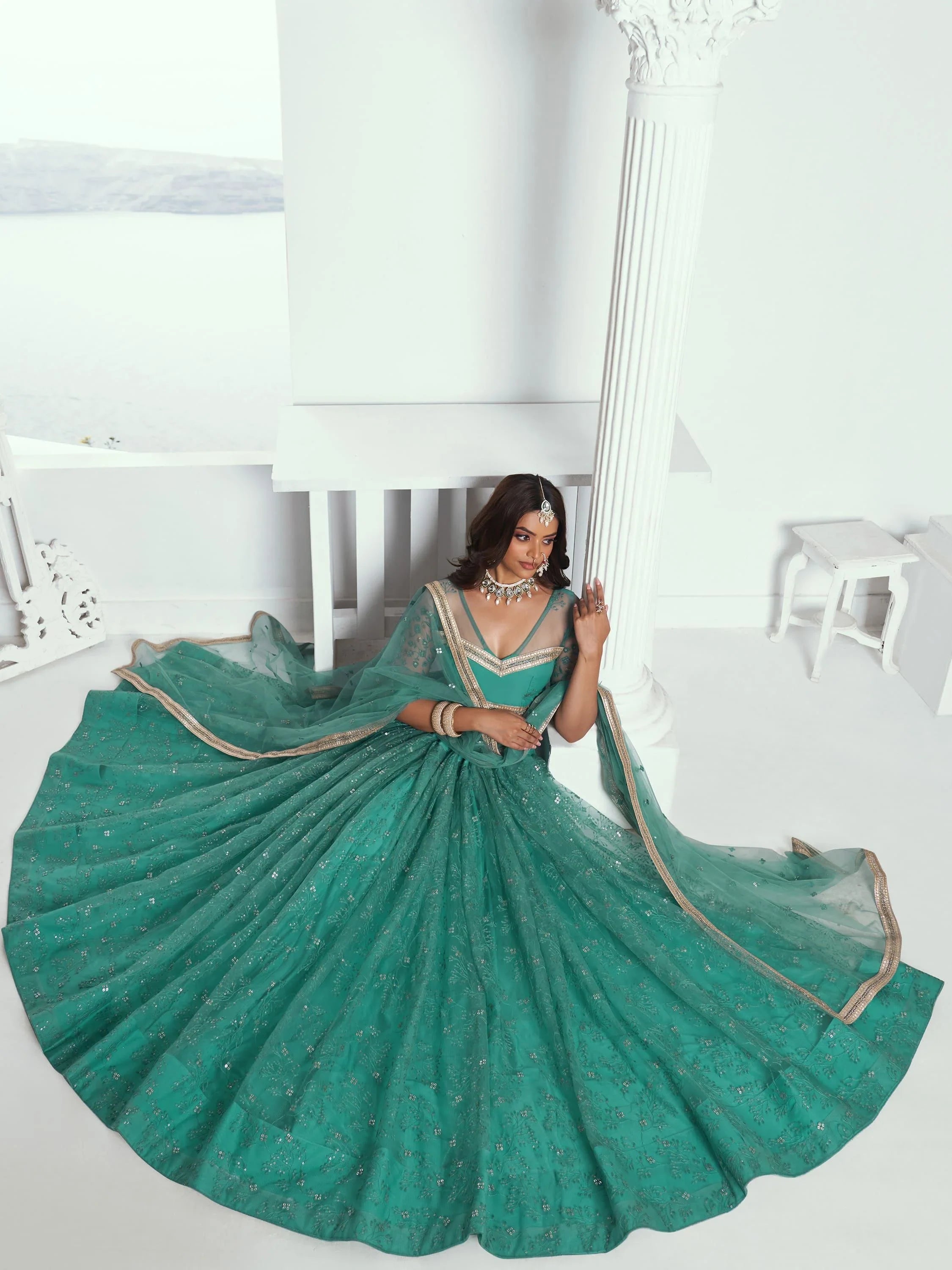 Amazing Rama Color Embroidered Net Engagement Wear Lehenga Choli
