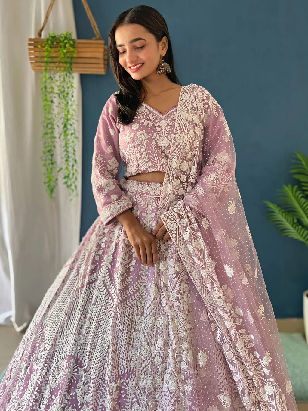 Astonishing Lilac Pearl Work Net Reception Wear Lehenga Choli
