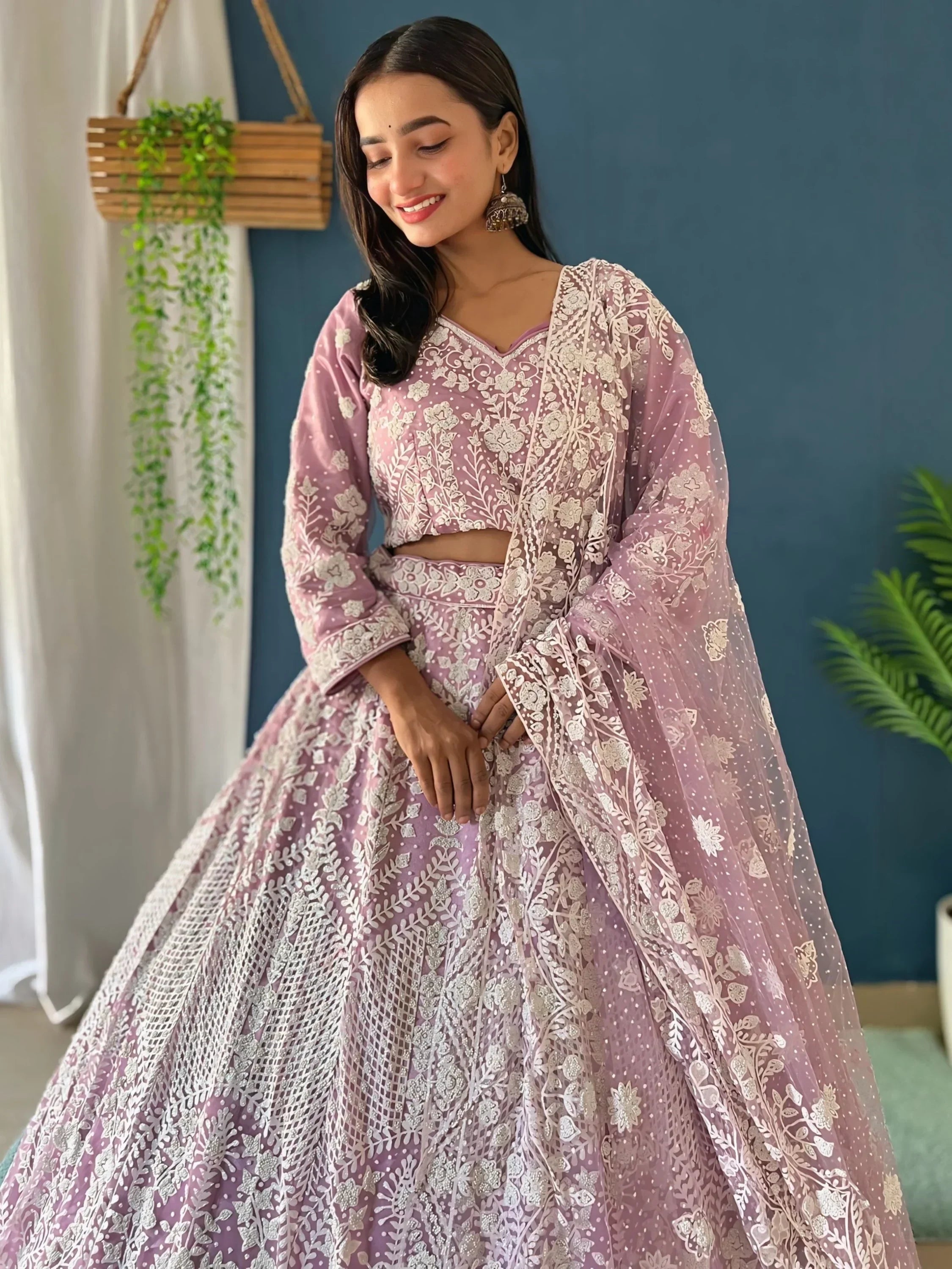 Astonishing Lilac Pearl Work Net Reception Wear Lehenga Choli