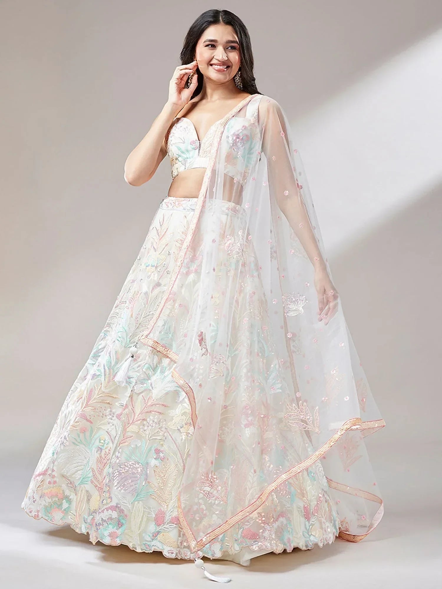 Off White Ravishing Color Sequins Soft Net Party Wear Lehenga Choli