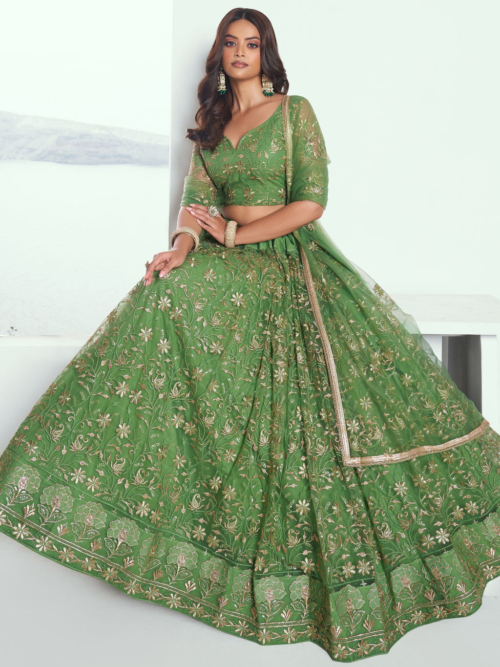 Attractive Green Color Embroidered Net Mehendi Wear Lehenga Choli