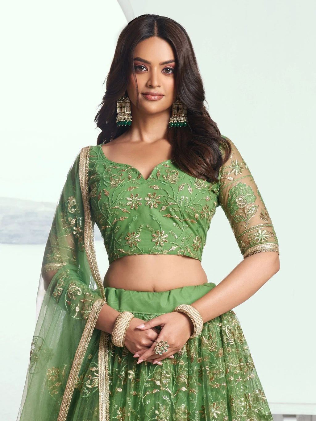 Attractive Green Color Embroidered Net Mehendi Wear Lehenga Choli