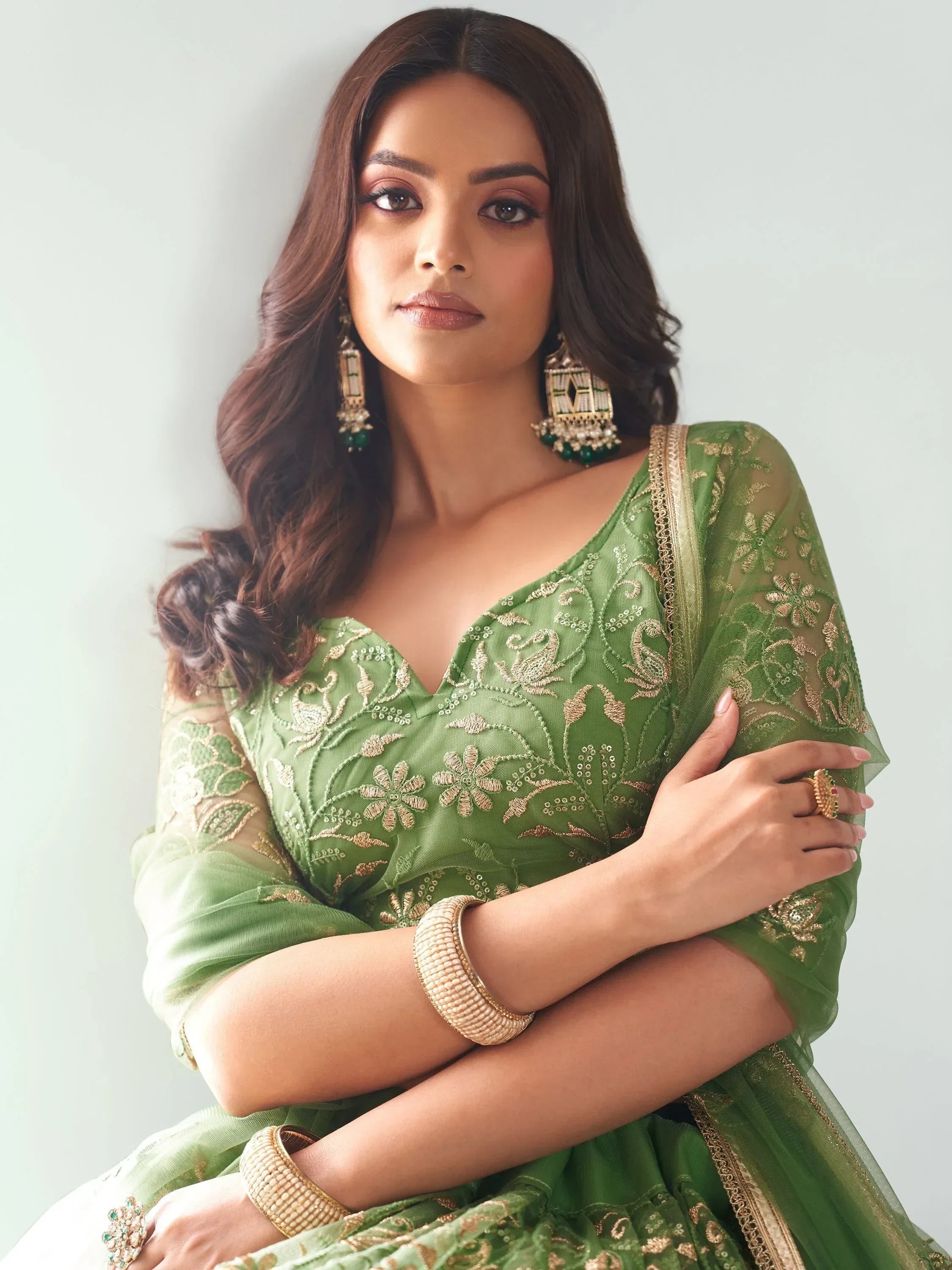 Attractive Green Color Embroidered Net Mehendi Wear Lehenga Choli