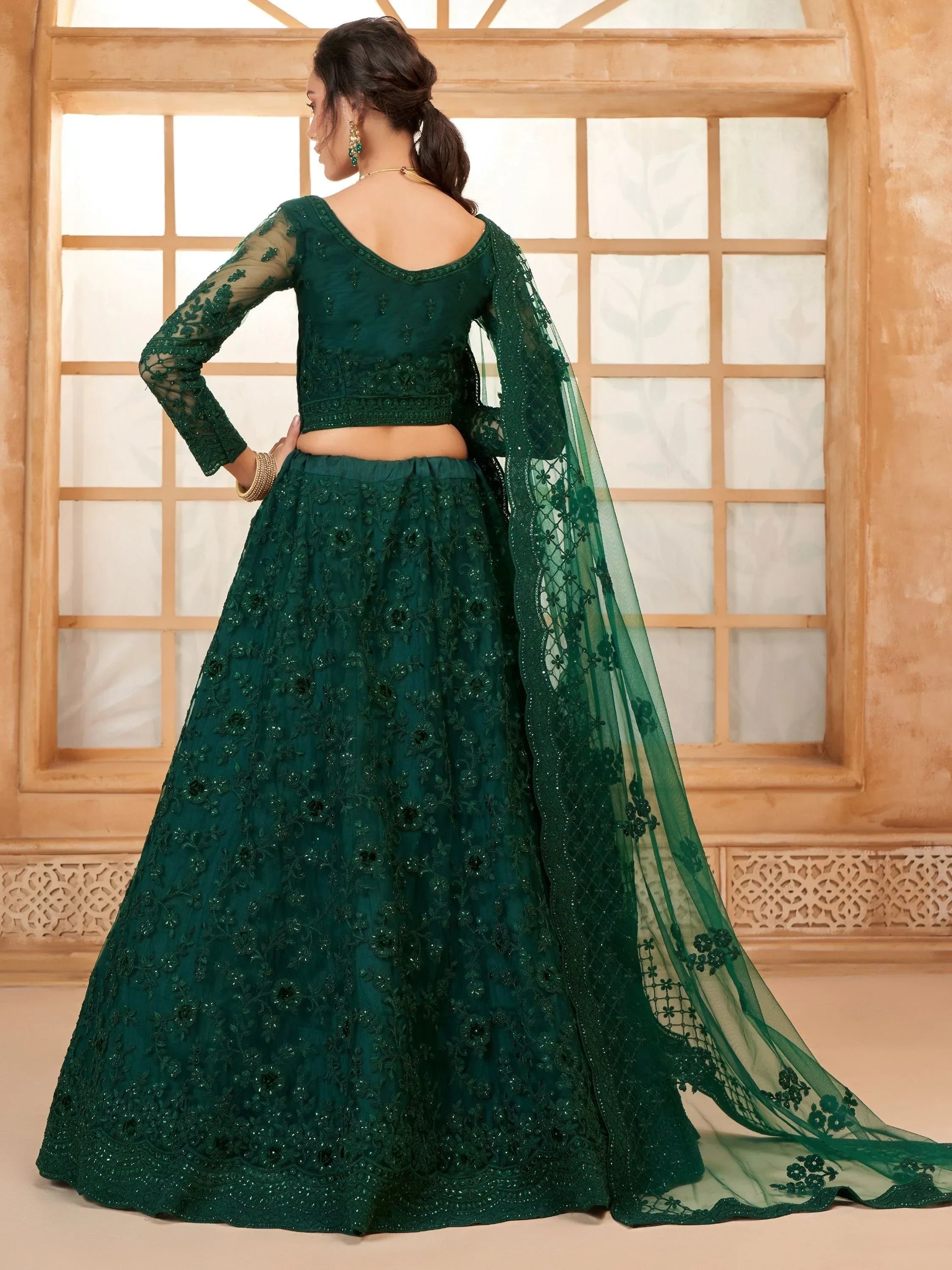 Beautiful Green Embroidered Net Mehendi Wear Lehenga Choli