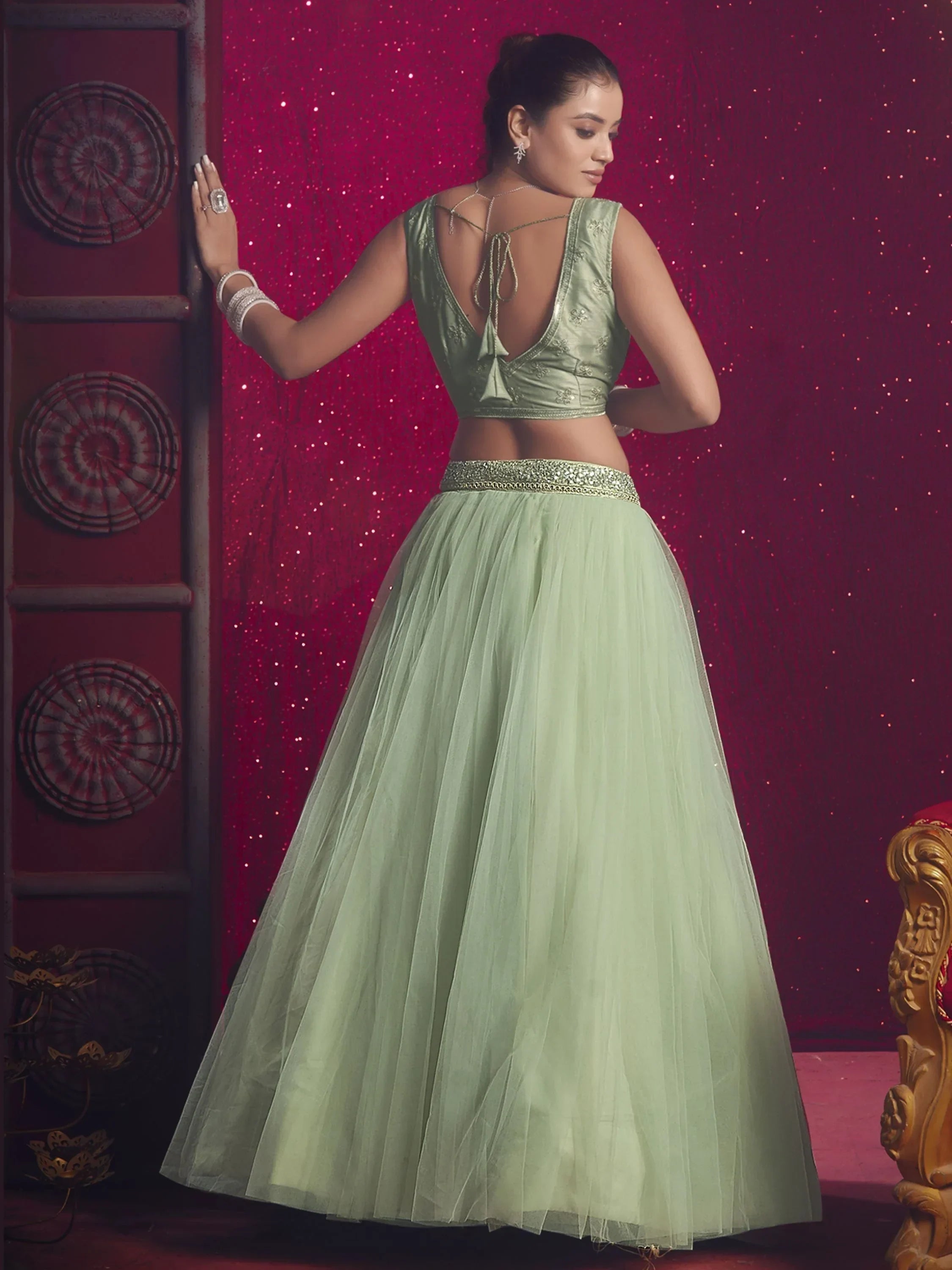 Beautiful Light Pista Sequins Net Engagement Wear Lehenga Choli