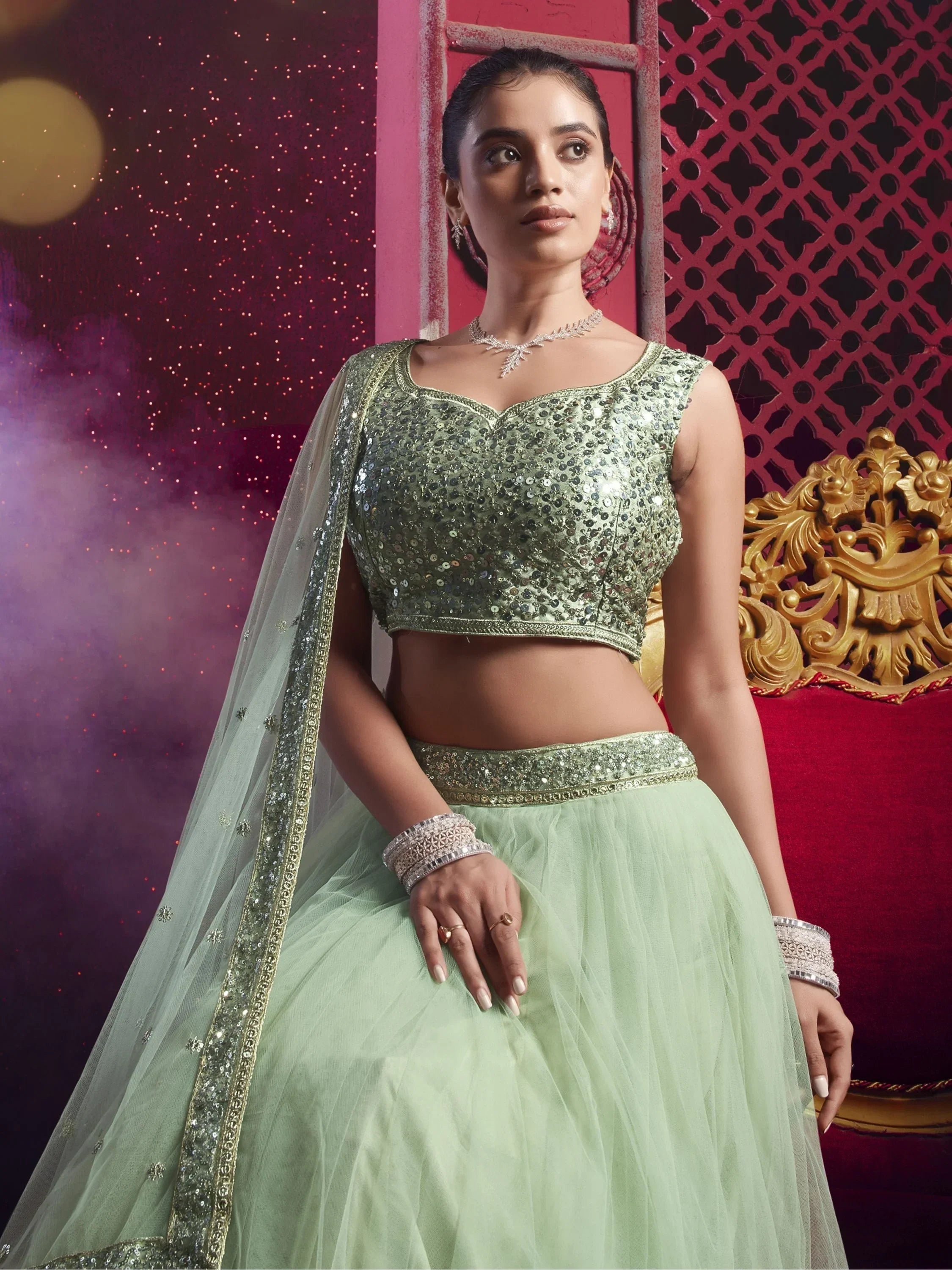 Beautiful Light Pista Sequins Net Engagement Wear Lehenga Choli