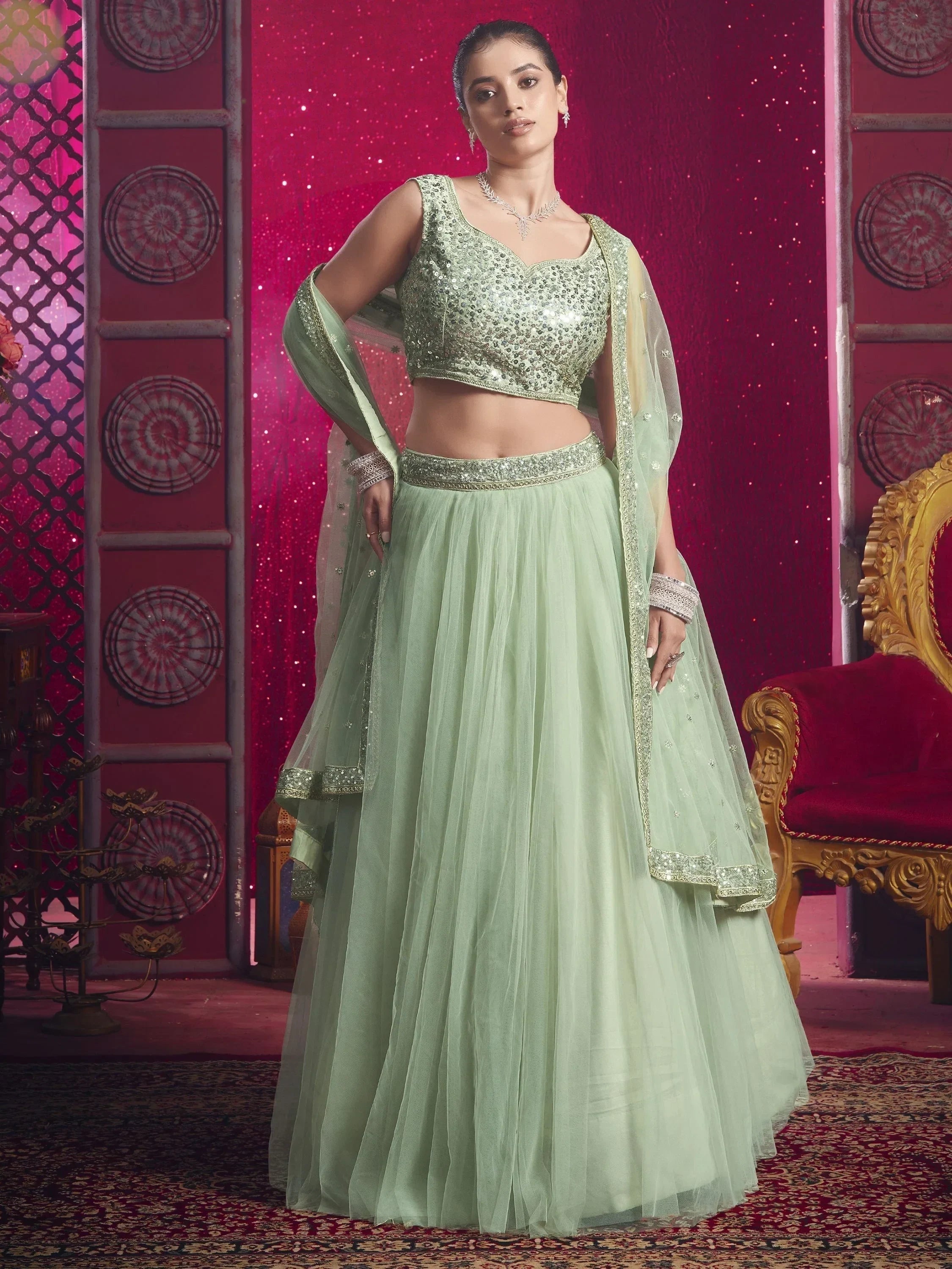 Beautiful Light Pista Sequins Net Engagement Wear Lehenga Choli