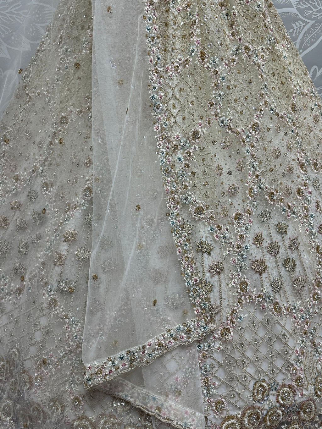 Off White Wonderful Zircon Work Net Bridesmaid Lehenga Choli With Dupatta