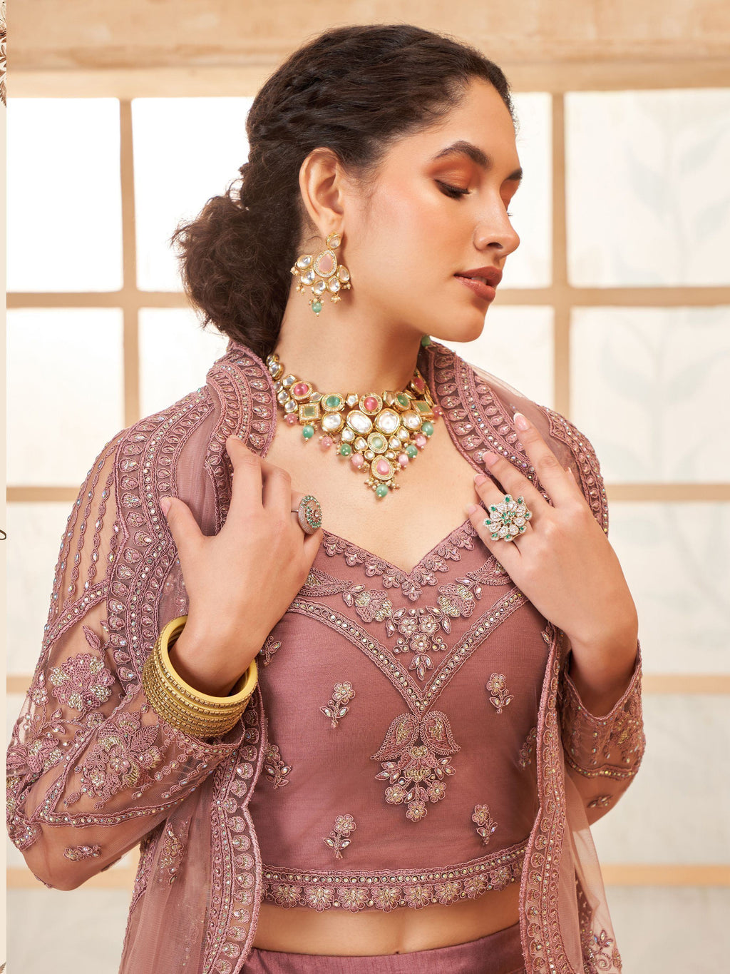 Captivating Mauve Embroidered Net Reception Wear Lehenga Choli
