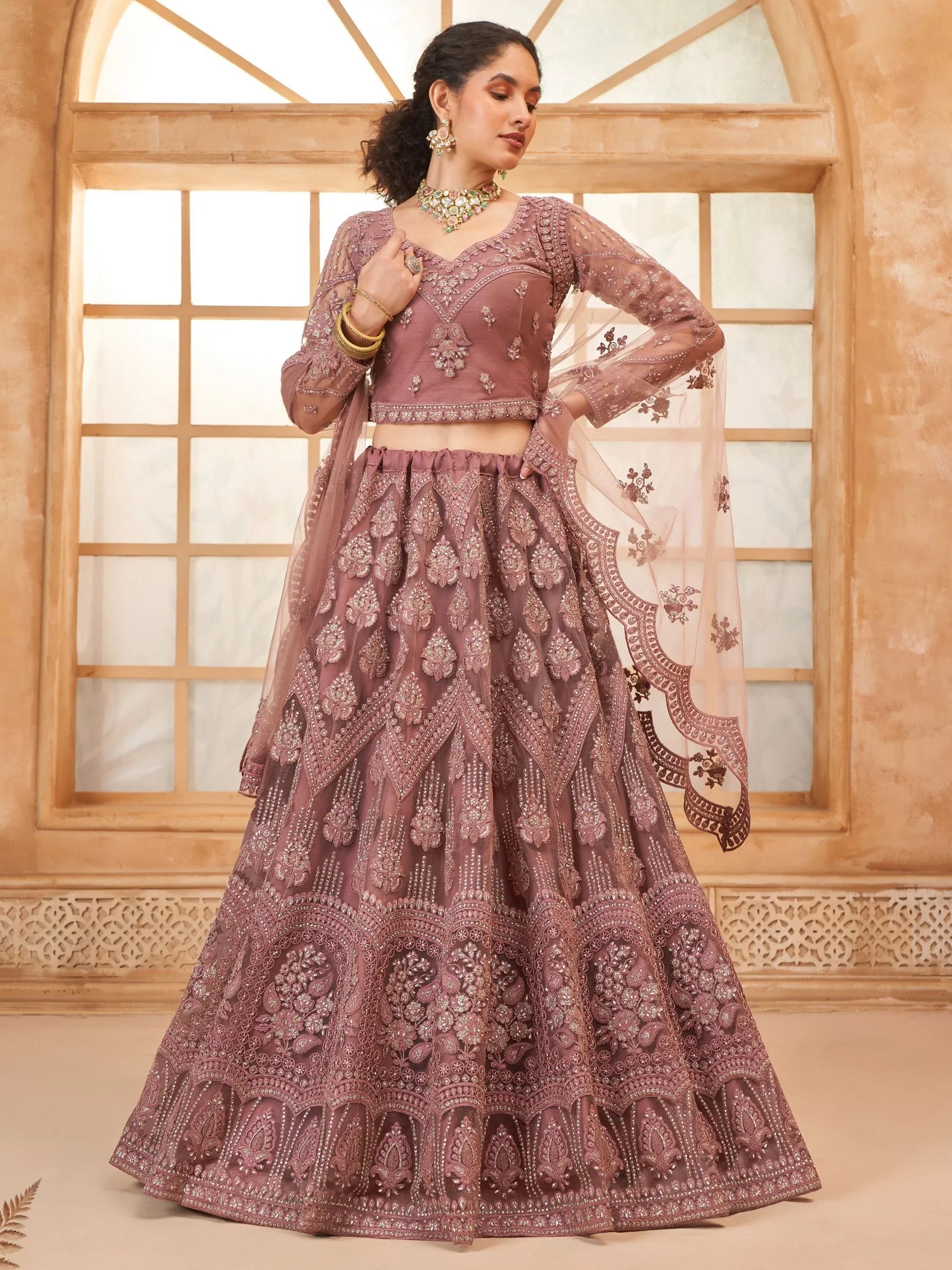 Captivating Mauve Embroidered Net Reception Wear Lehenga Choli