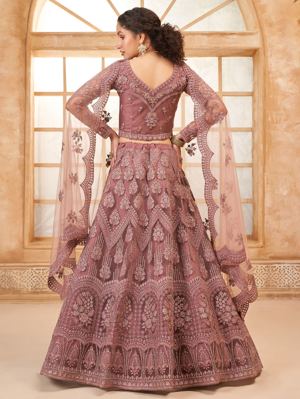 Captivating Mauve Embroidered Net Reception Wear Lehenga Choli
