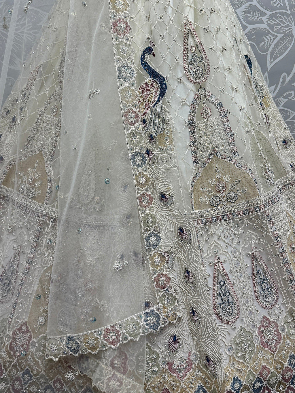 Off White Gorgeous Sequins Net Engagement Wear Lehenga Choli