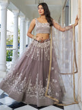 Dazzling Mauve Embroidered Net Engagement Wear Lehenga Choli