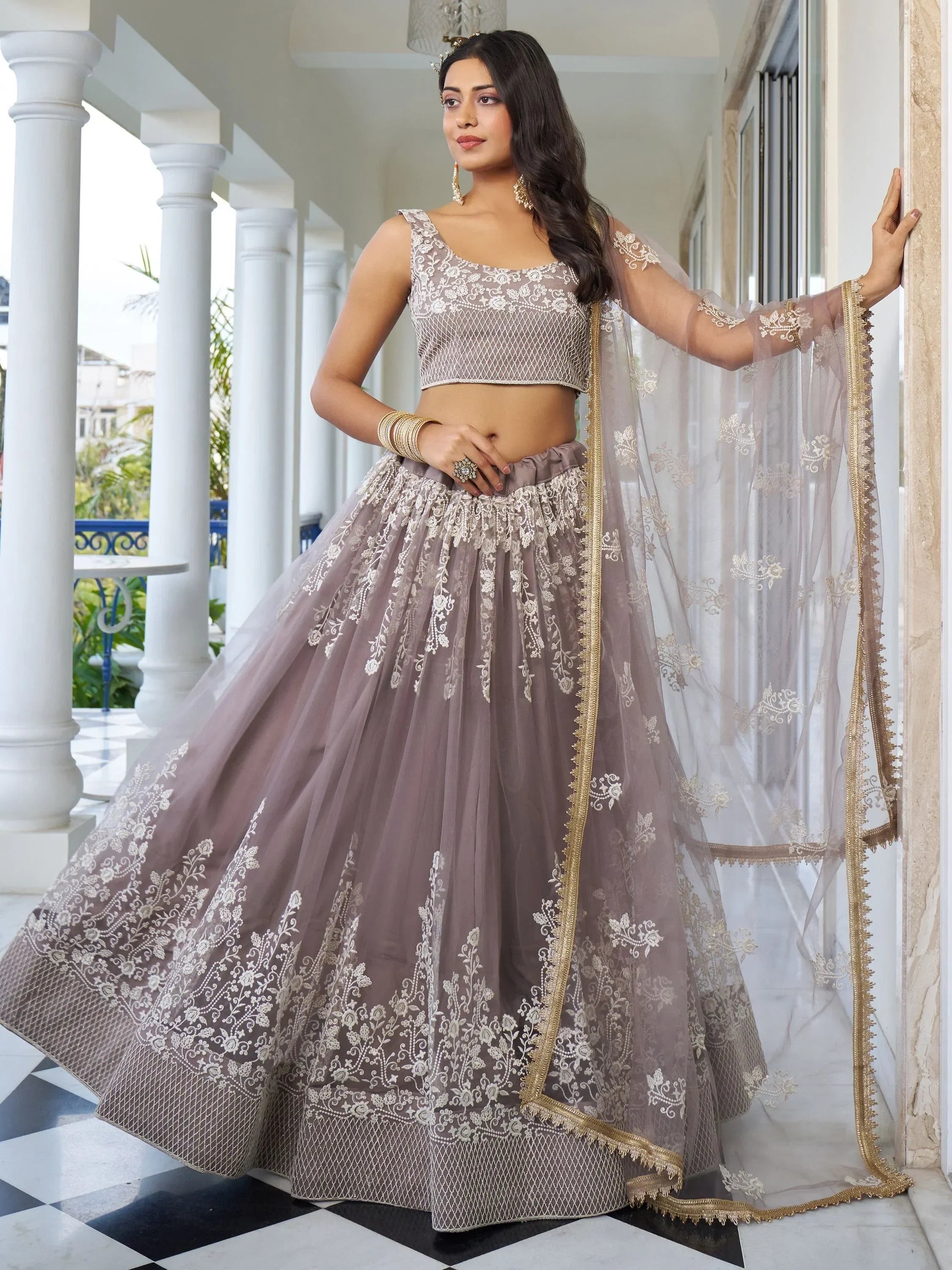 Dazzling Mauve Embroidered Net Engagement Wear Lehenga Choli