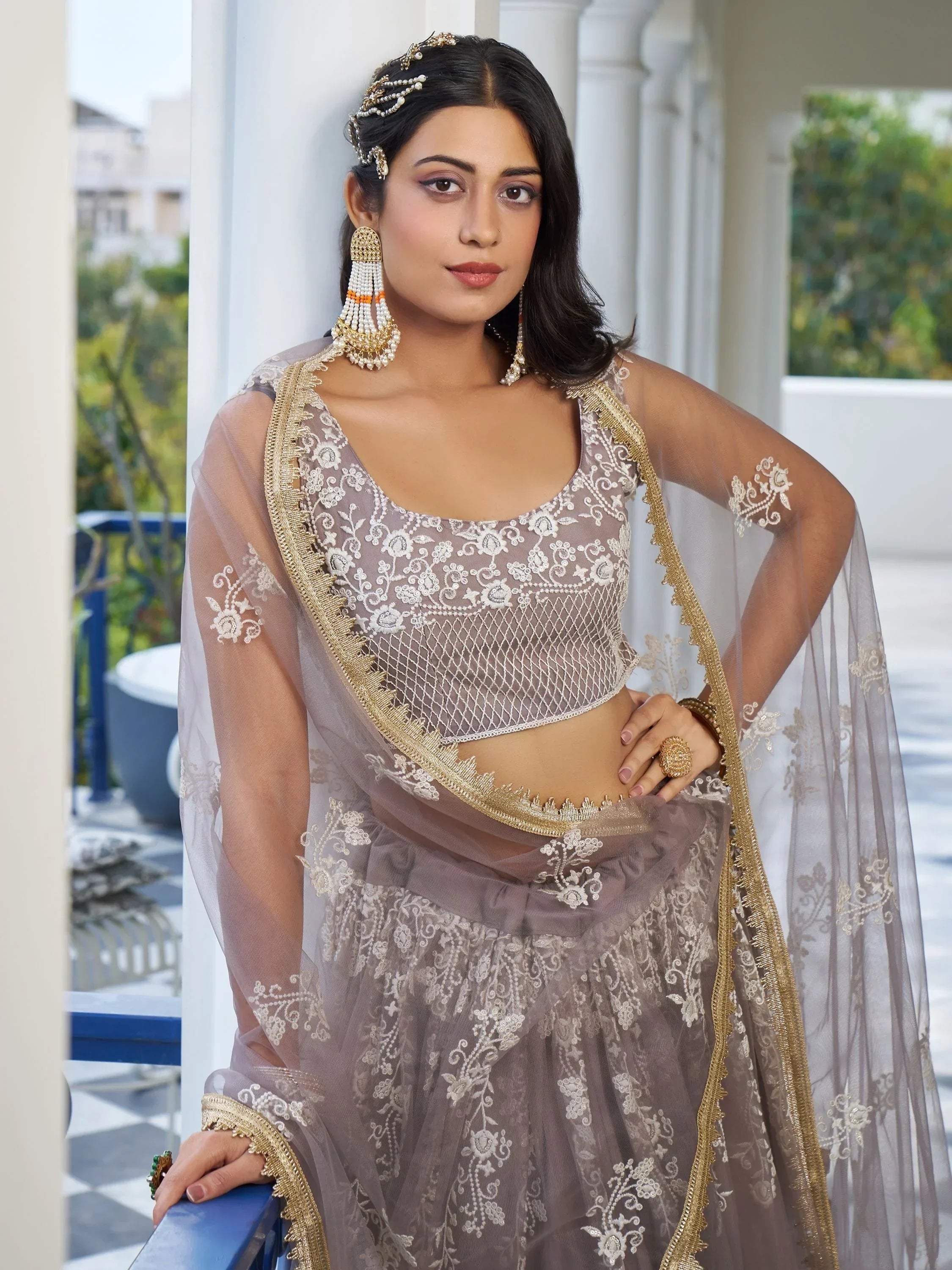 Dazzling Mauve Embroidered Net Engagement Wear Lehenga Choli