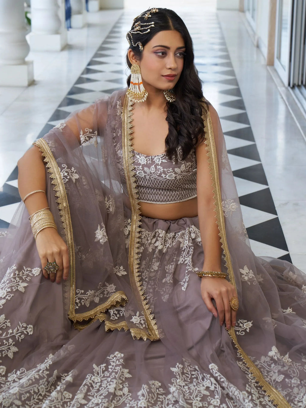 Dazzling Mauve Embroidered Net Engagement Wear Lehenga Choli