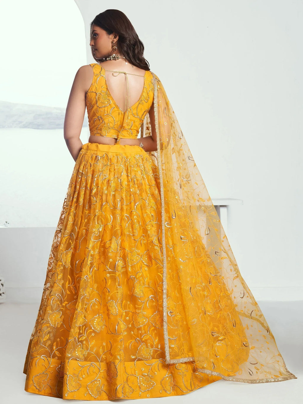 Endearing Yellow Color Embroidered Net Function Wear Lehenga Choli