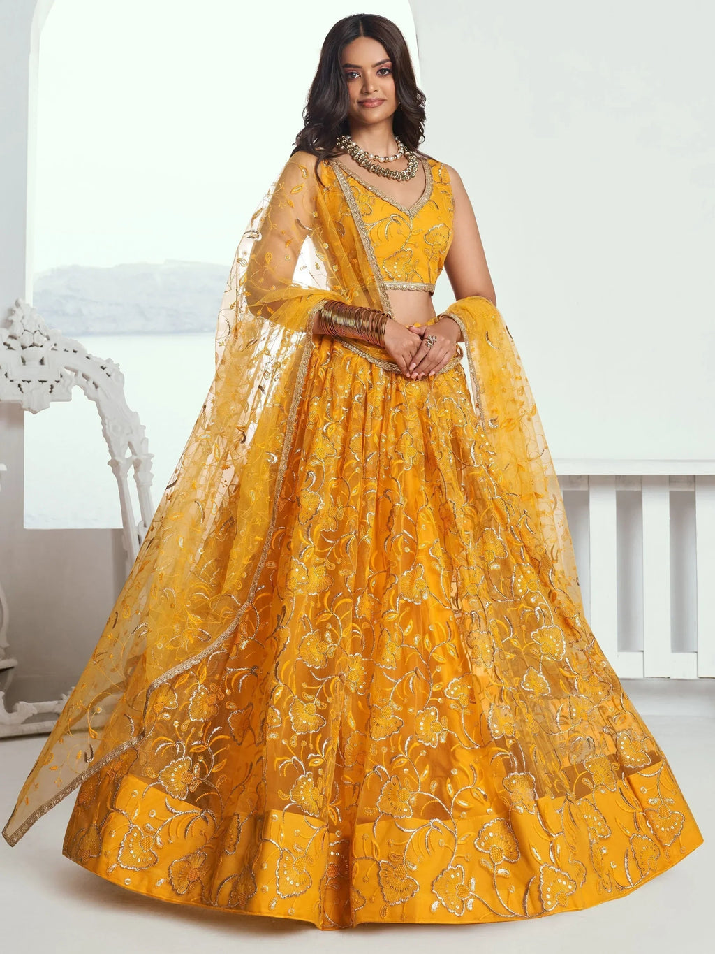 Endearing Yellow Color Embroidered Net Function Wear Lehenga Choli