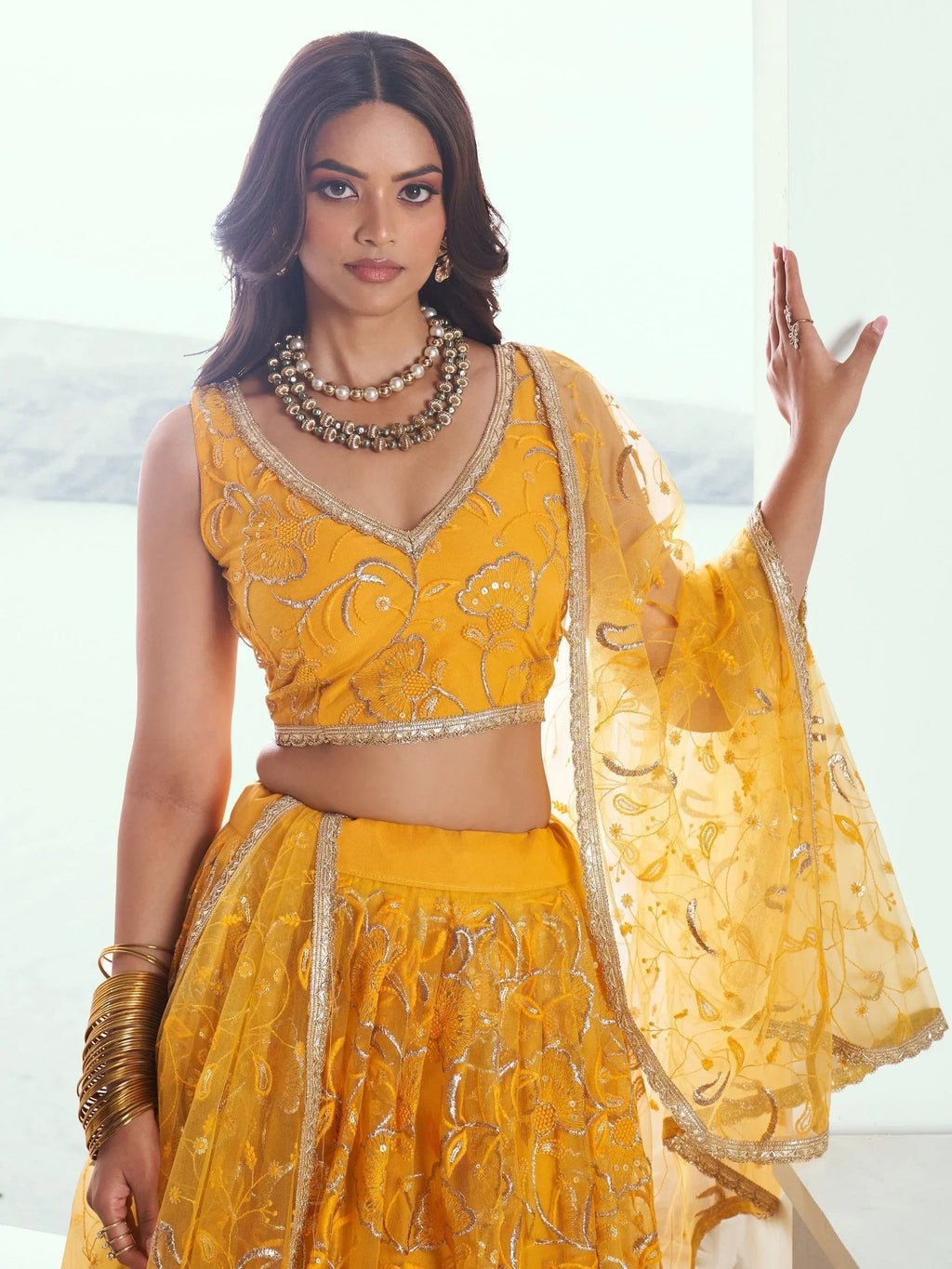 Endearing Yellow Color Embroidered Net Function Wear Lehenga Choli