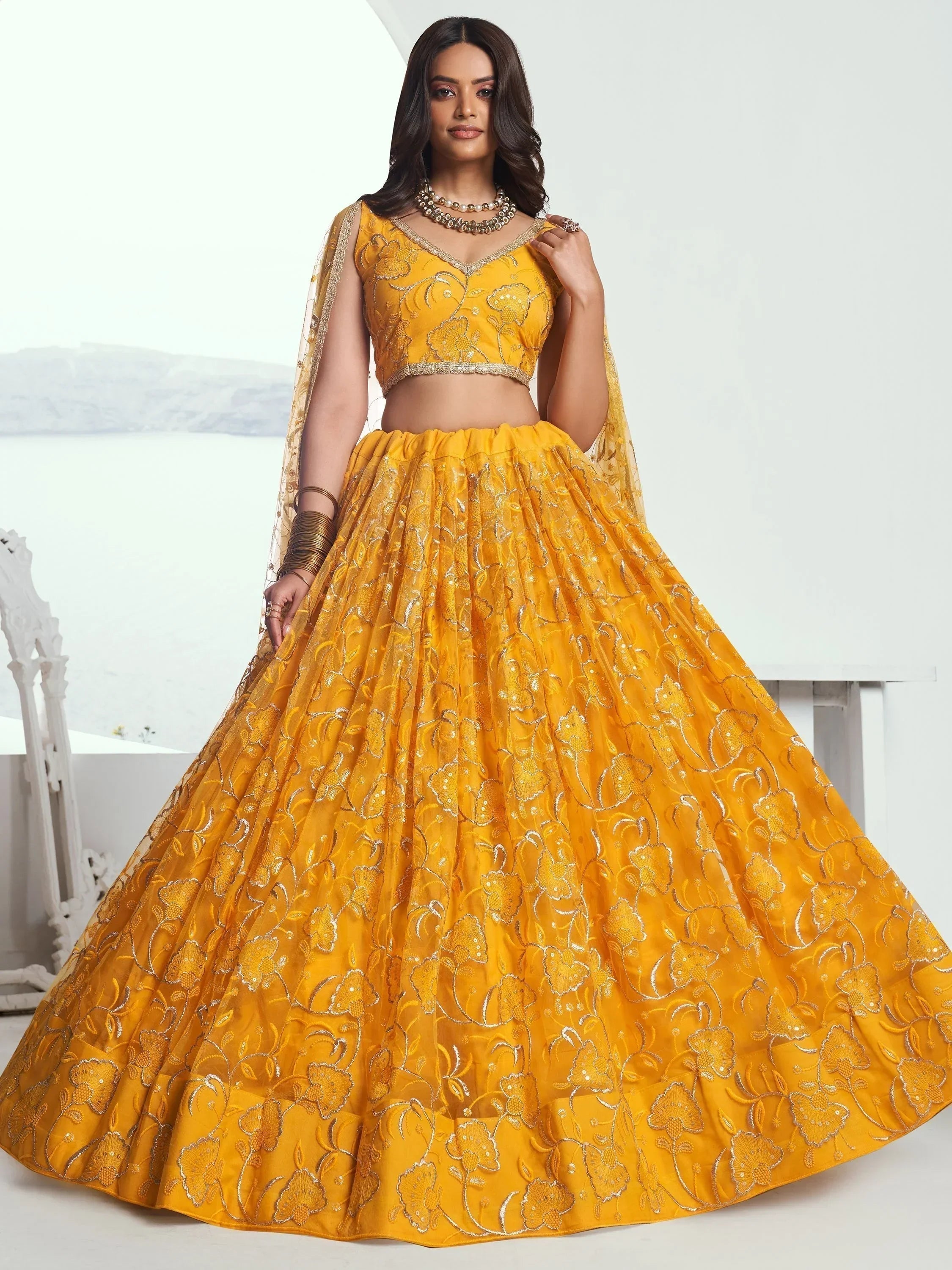 Endearing Yellow Color Embroidered Net Function Wear Lehenga Choli