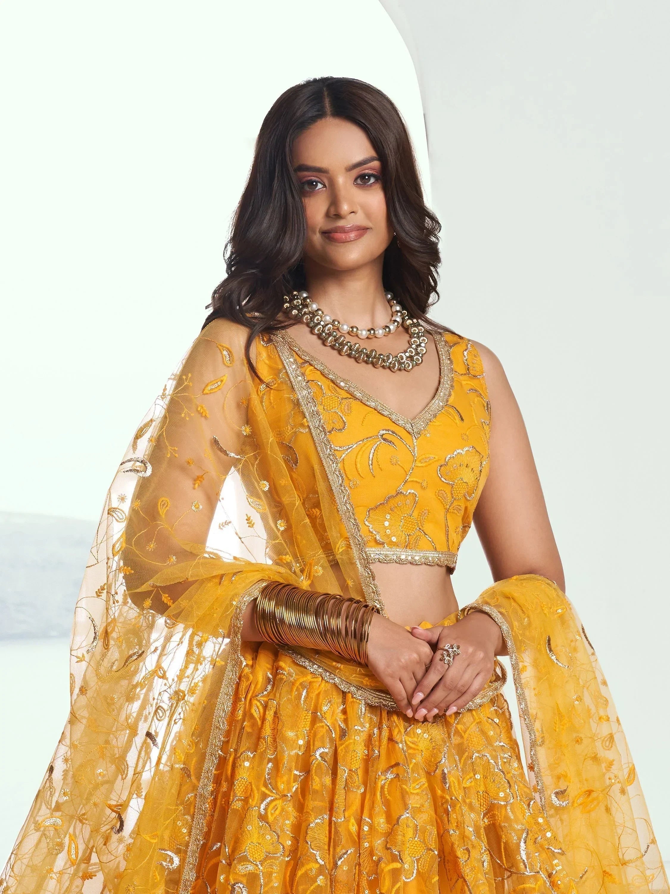 Endearing Yellow Color Embroidered Net Function Wear Lehenga Choli