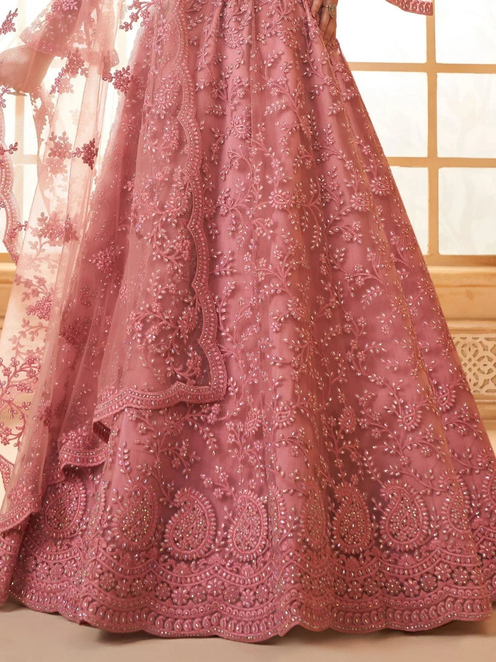 Excellent Dusty Pink Embroidered Net Engagement Wear Lehenga Choli
