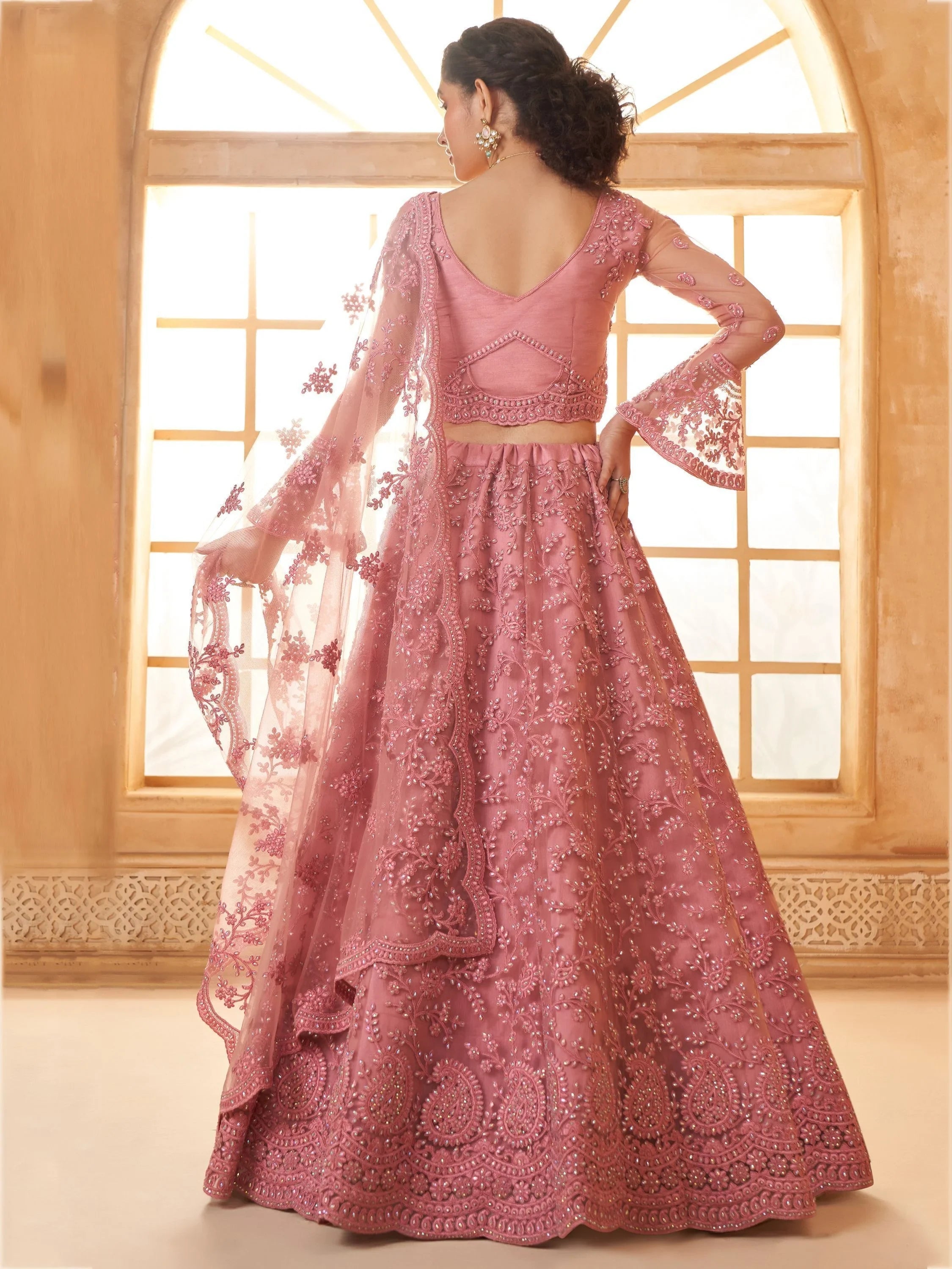 Excellent Dusty Pink Embroidered Net Engagement Wear Lehenga Choli