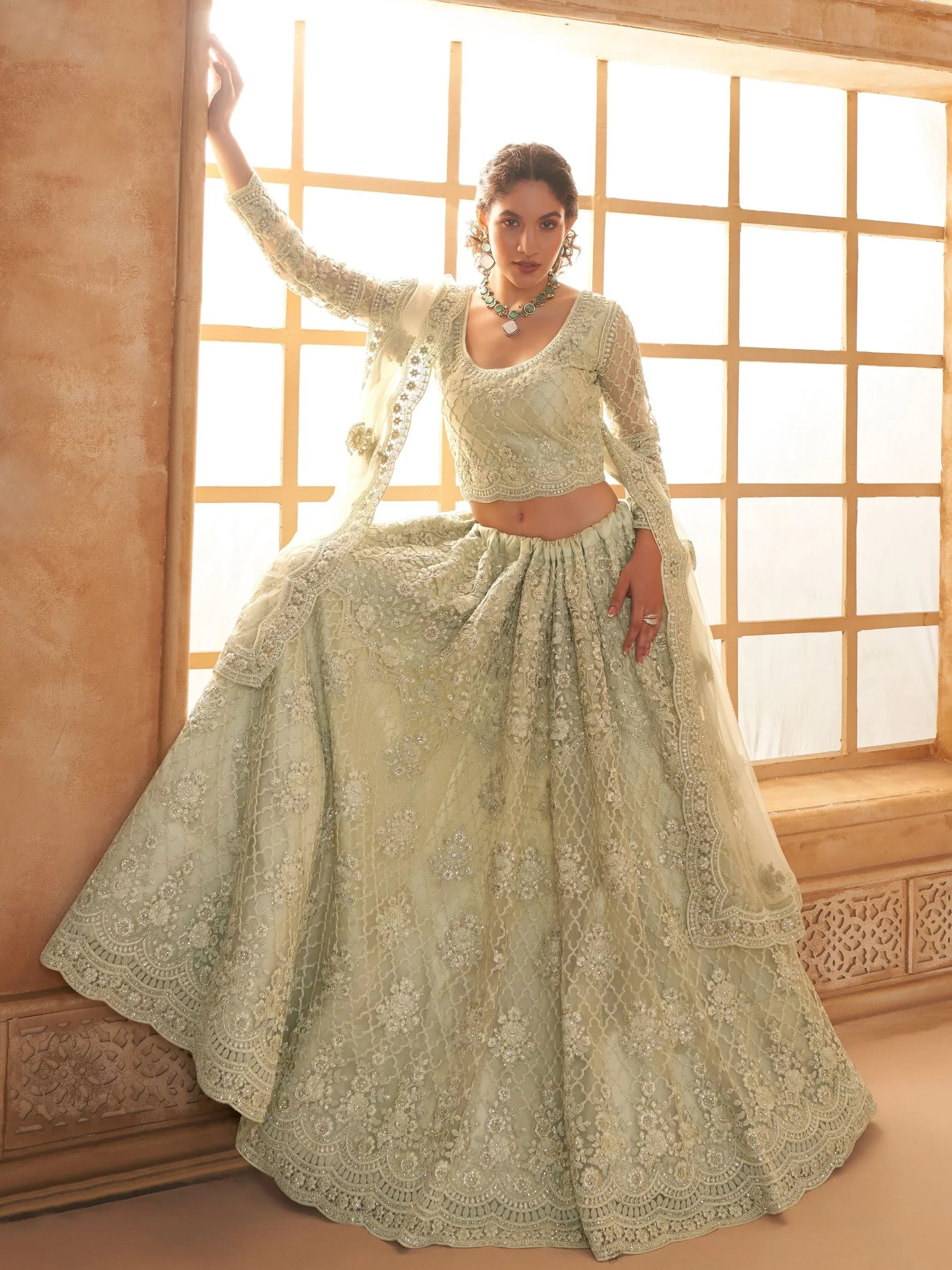 Fabulous Pista Green Embroidered Net Lehenga Choli With Dupatta