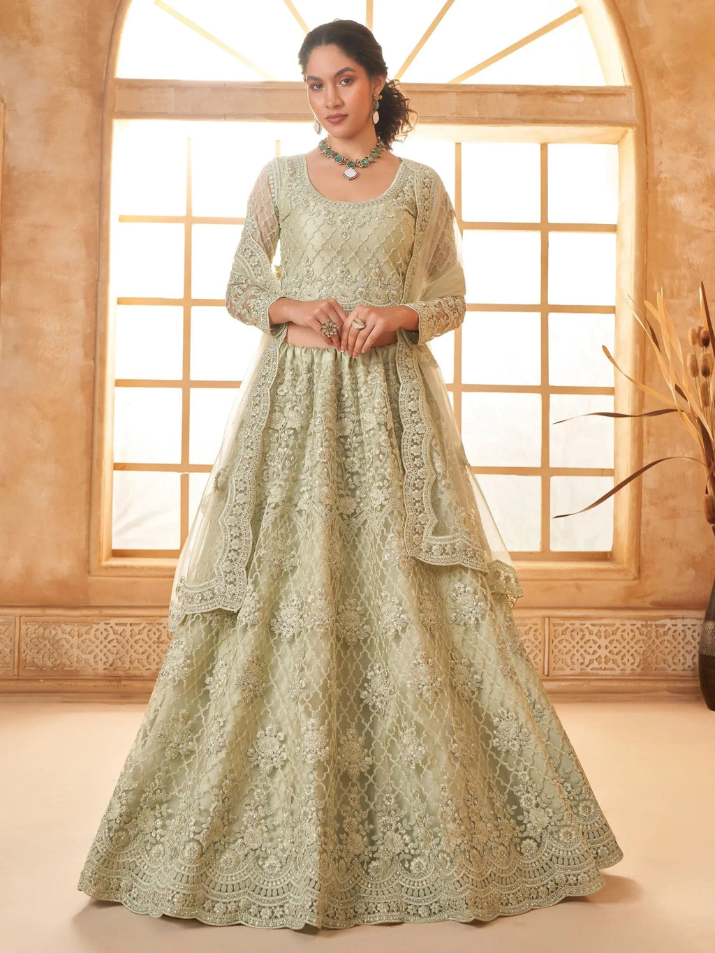 Fabulous Pista Green Embroidered Net Lehenga Choli With Dupatta