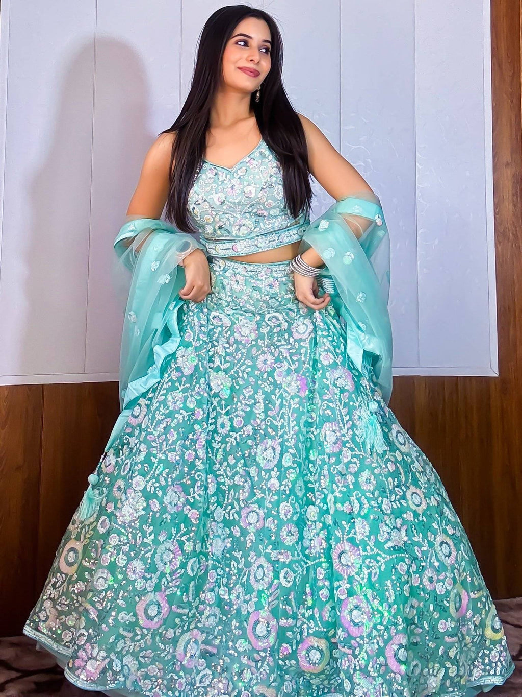 Fascinating Blue Sequins Net Reception Wear Lehenga Choli With Dupatta