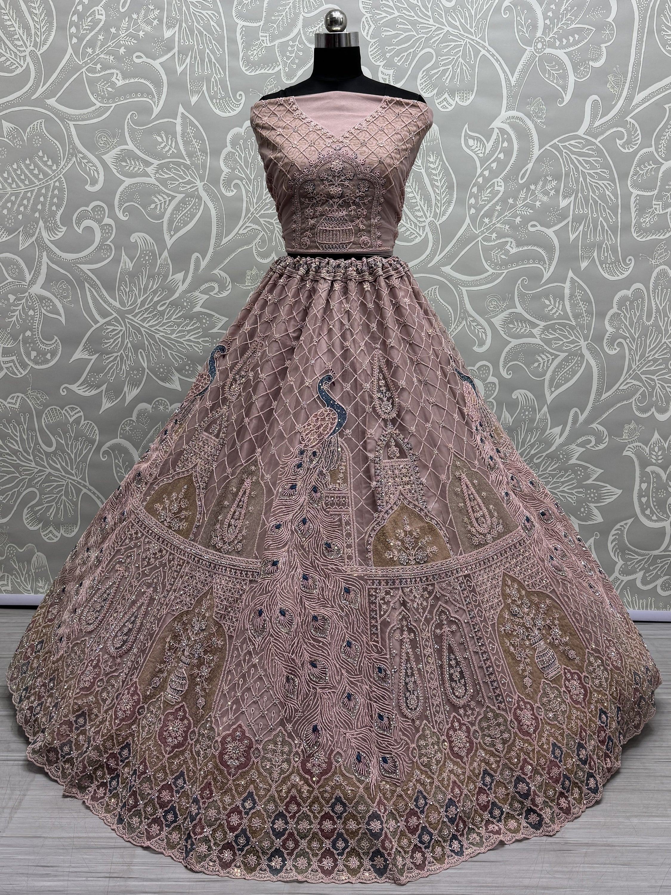 Peach Gorgeous Sequins Net Engagement Wear Lehenga Choli