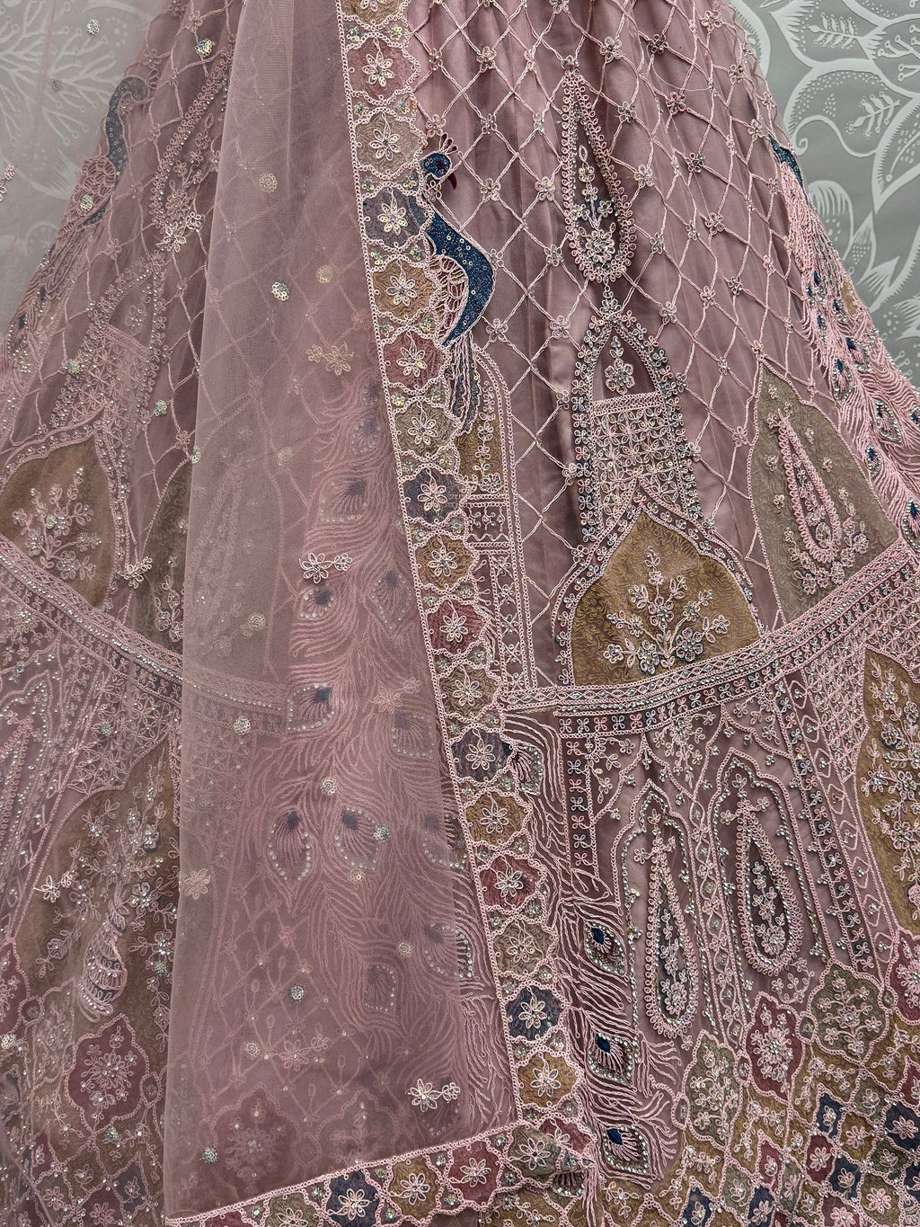 Peach Gorgeous Sequins Net Engagement Wear Lehenga Choli