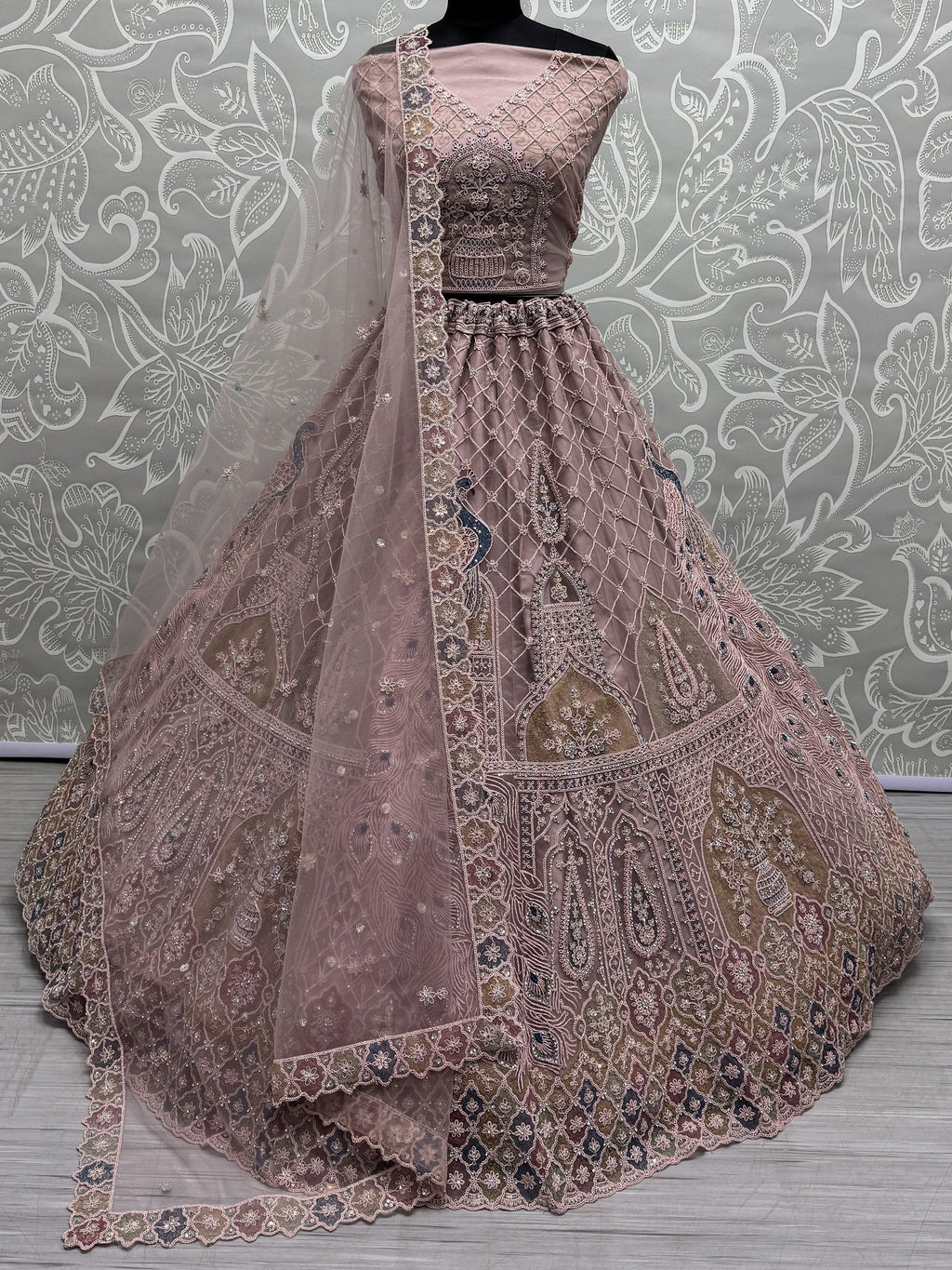 Peach Gorgeous Sequins Net Engagement Wear Lehenga Choli