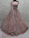 Peach Gorgeous Sequins Net Engagement Wear Lehenga Choli