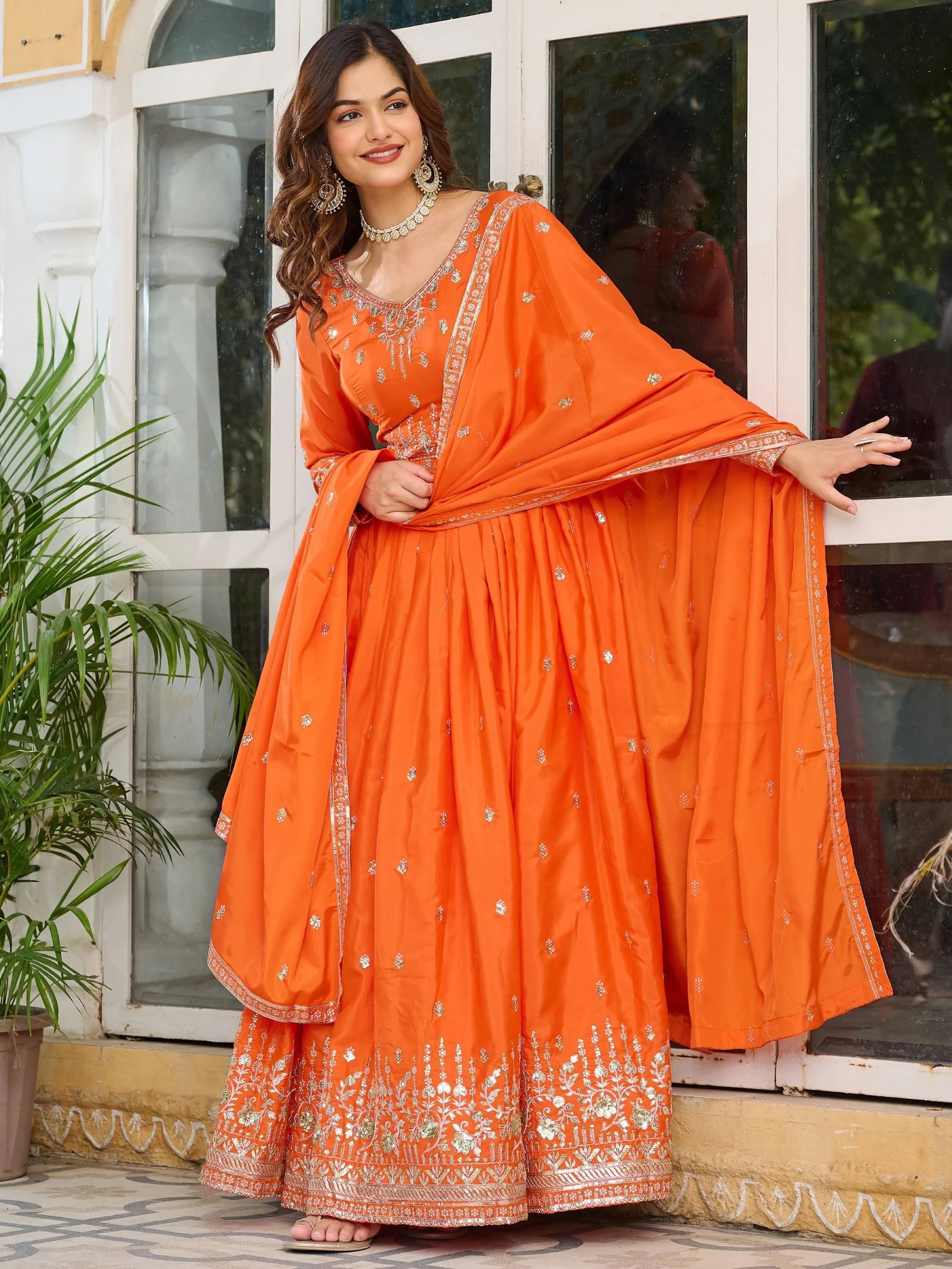 Orange Spectacular Sequins Work Silk Festive Wear Gown With Dupatta