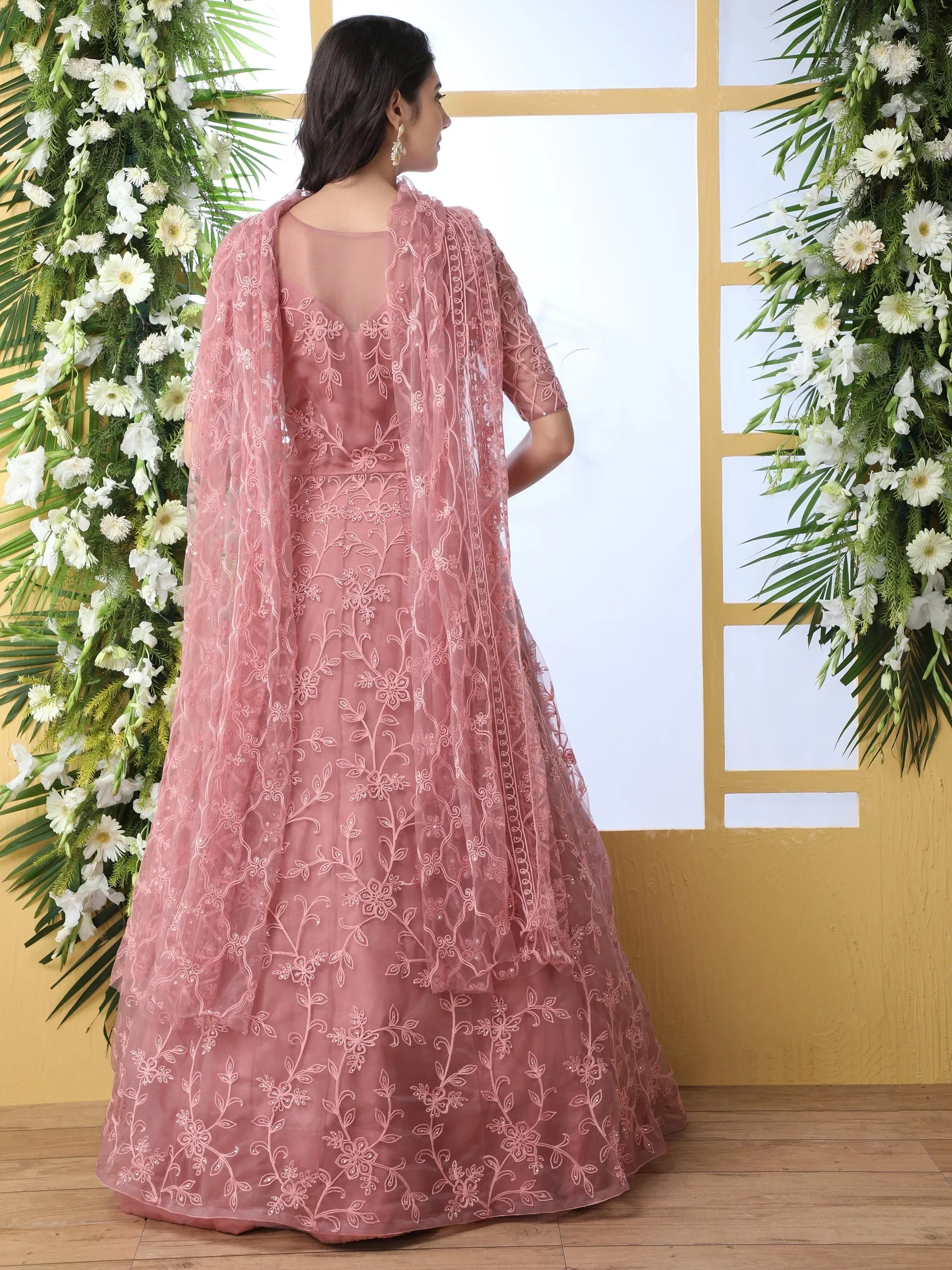 Enchanting Dusty Peach Thread Embroidered Net Engagement Wear Gown