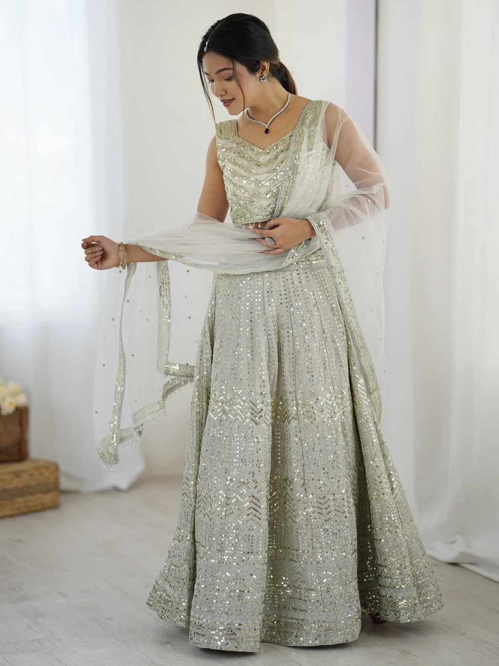 Luxurious Off White Georgette Sequins Bridesmaid Lehenga Choli