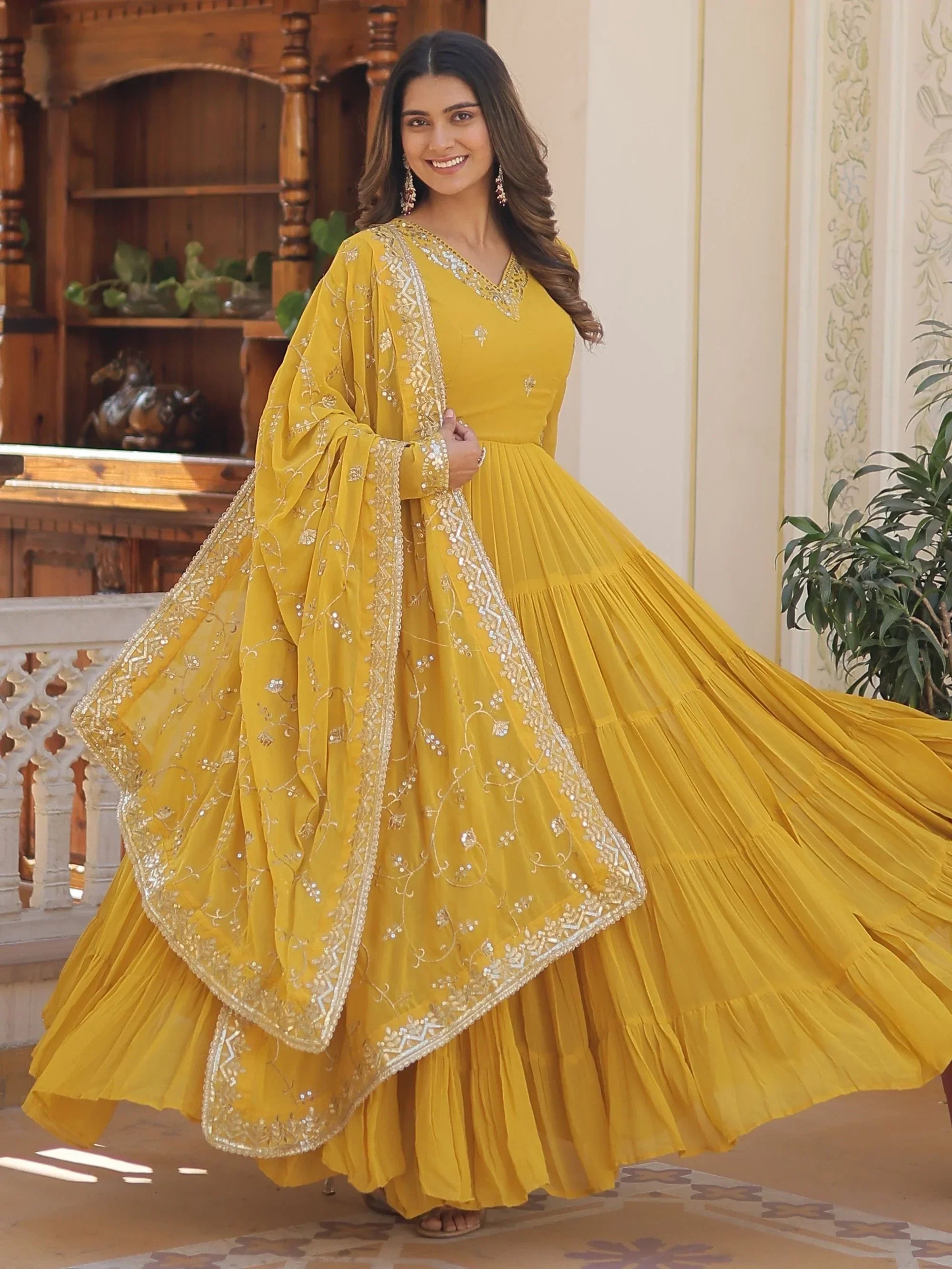 Yellow Gorgeous Light Embroidered Georgette Mehendi Wear Gown