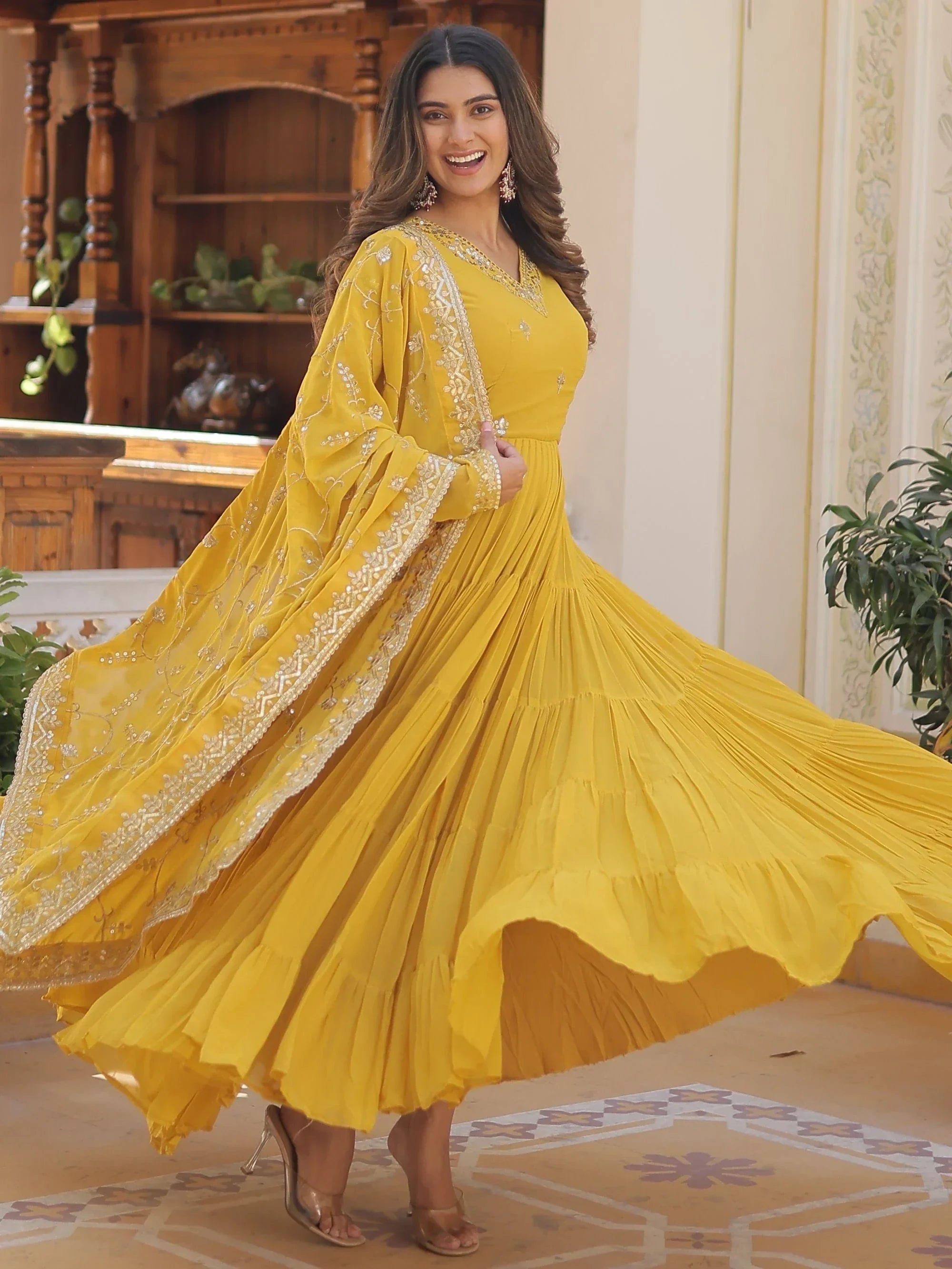 Yellow Gorgeous Light Embroidered Georgette Mehendi Wear Gown