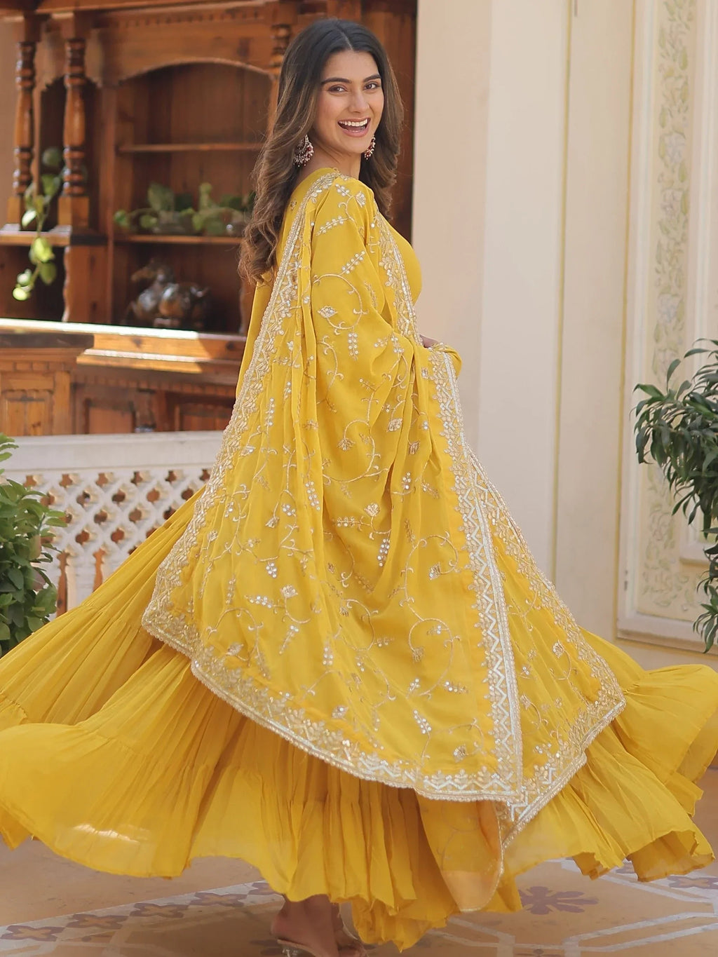 Yellow Gorgeous Light Embroidered Georgette Mehendi Wear Gown