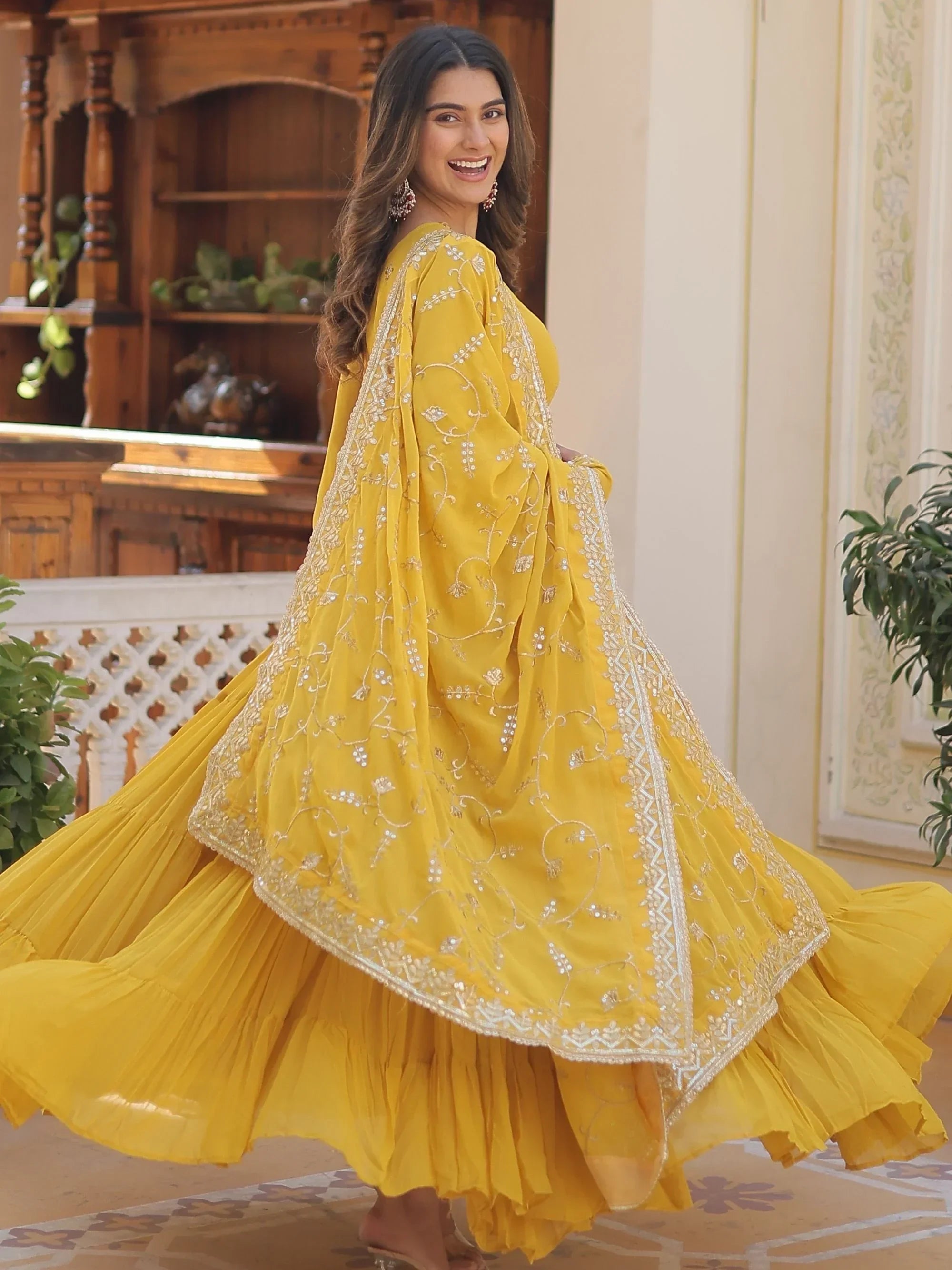 Yellow Gorgeous Light Embroidered Georgette Mehendi Wear Gown