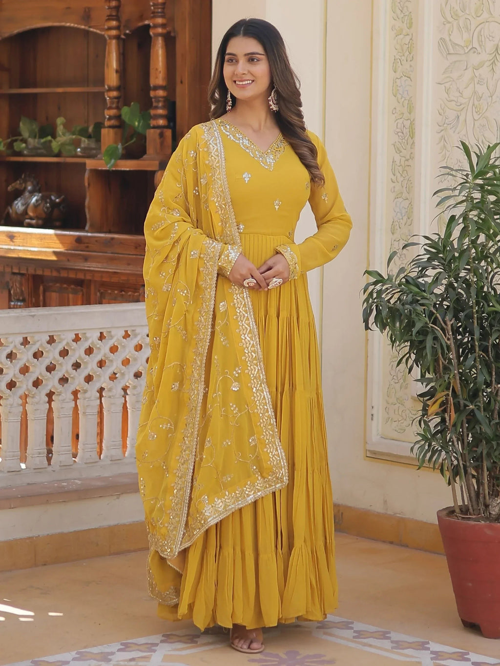 Yellow Gorgeous Light Embroidered Georgette Mehendi Wear Gown
