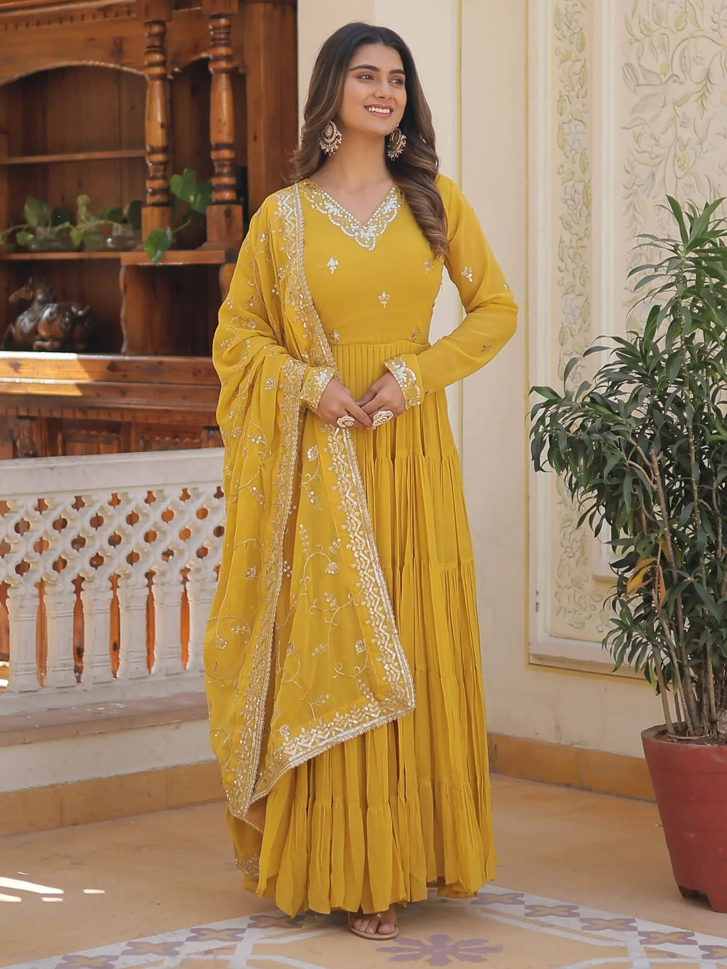 Yellow Gorgeous Light Embroidered Georgette Mehendi Wear Gown