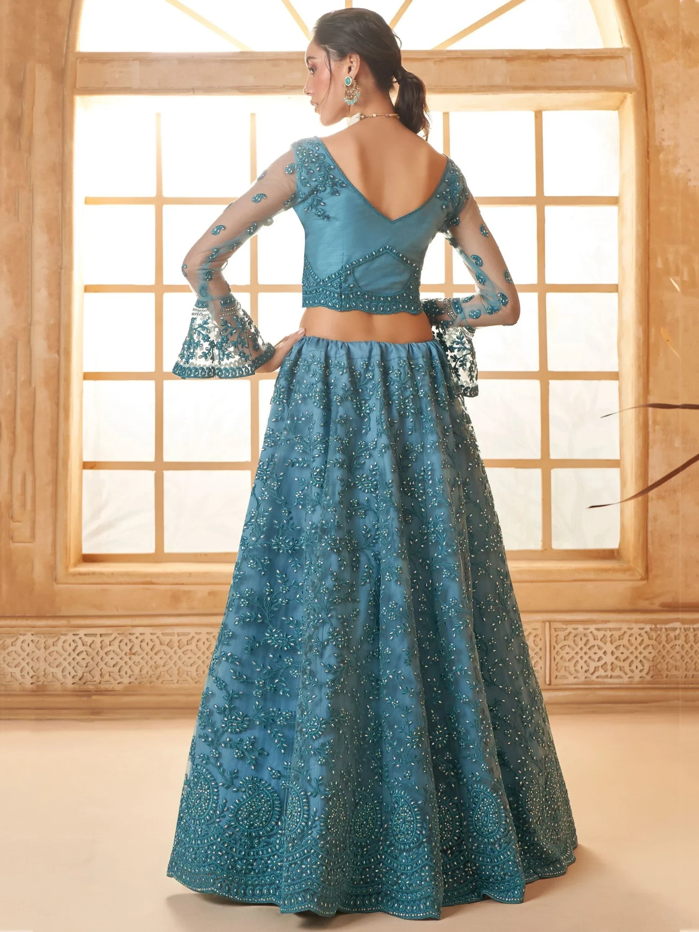 Outstanding Teal Blue Embroidered Net Designer Lehenga Choli