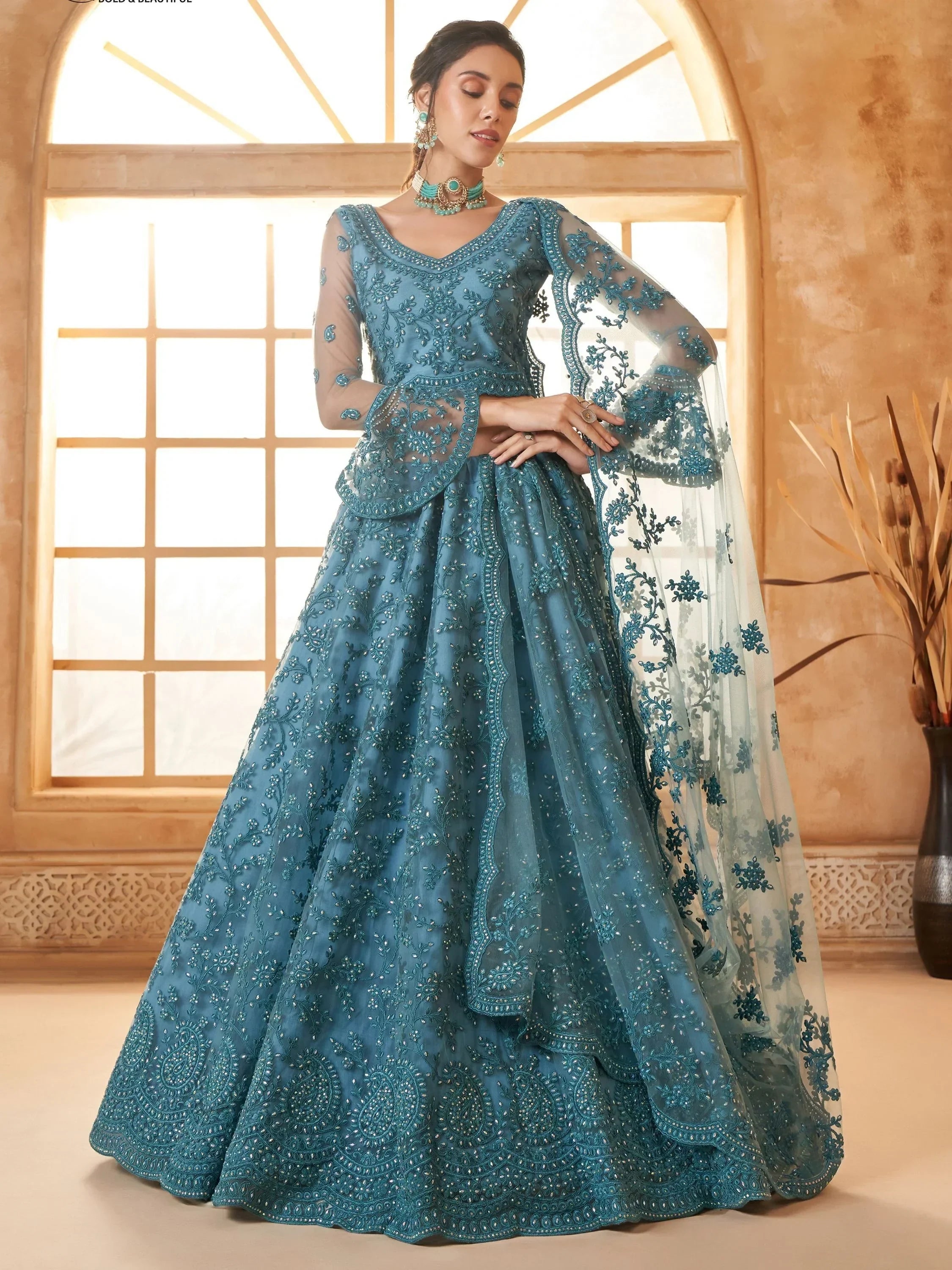 Outstanding Teal Blue Embroidered Net Designer Lehenga Choli