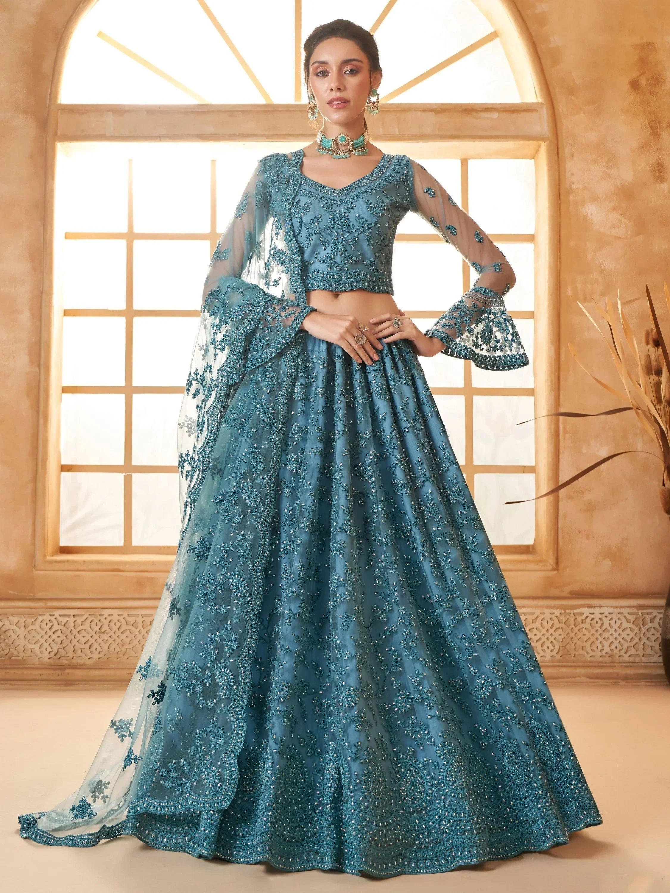 Outstanding Teal Blue Embroidered Net Designer Lehenga Choli