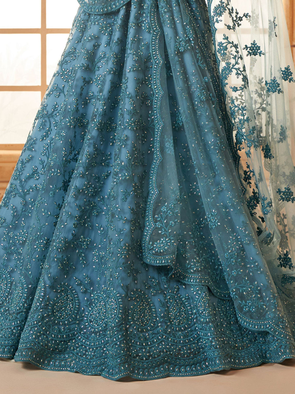 Outstanding Teal Blue Embroidered Net Designer Lehenga Choli
