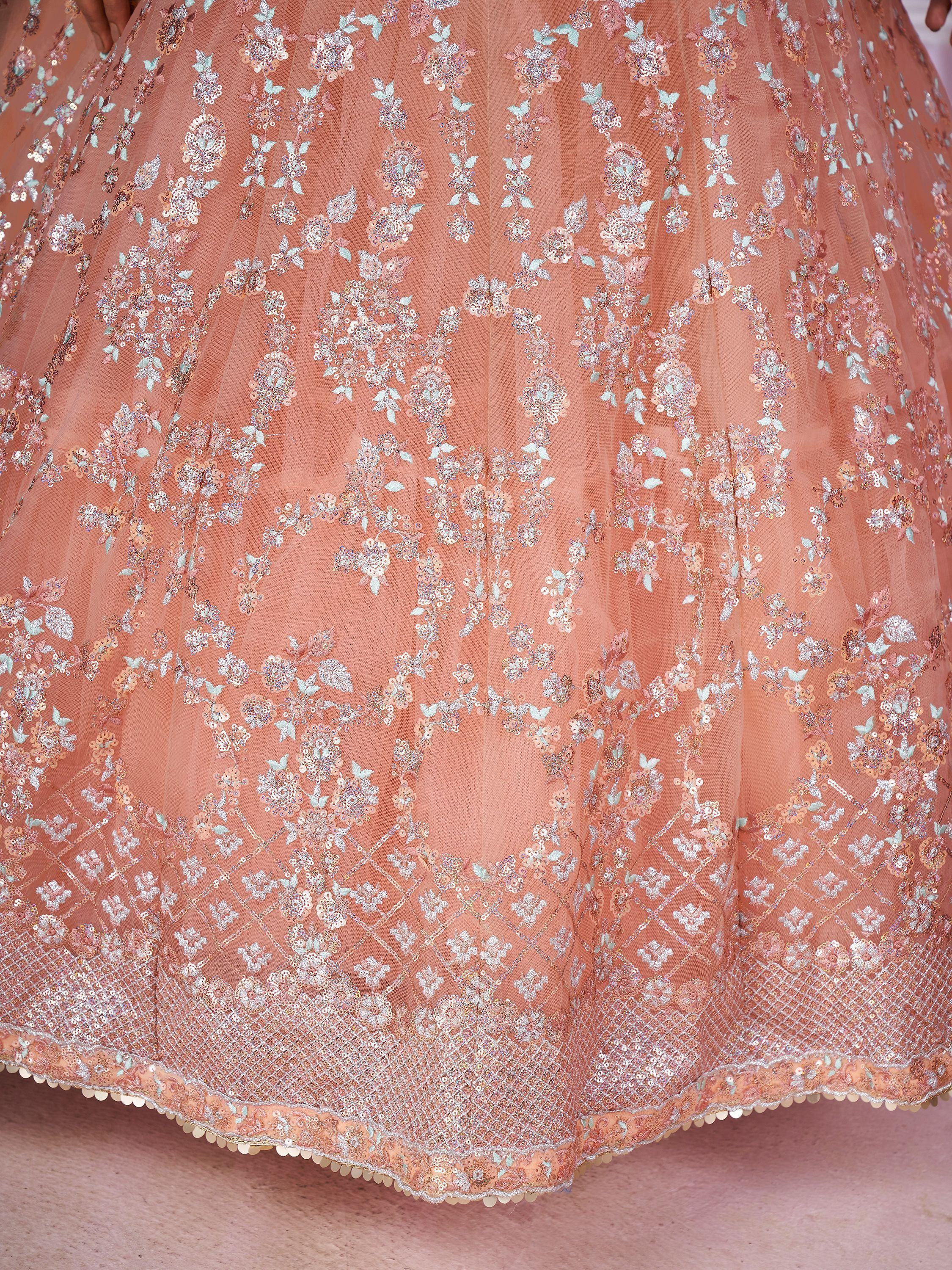 Pretty Peach Sequins Soft Net Engagement Wear Lehenga Choli