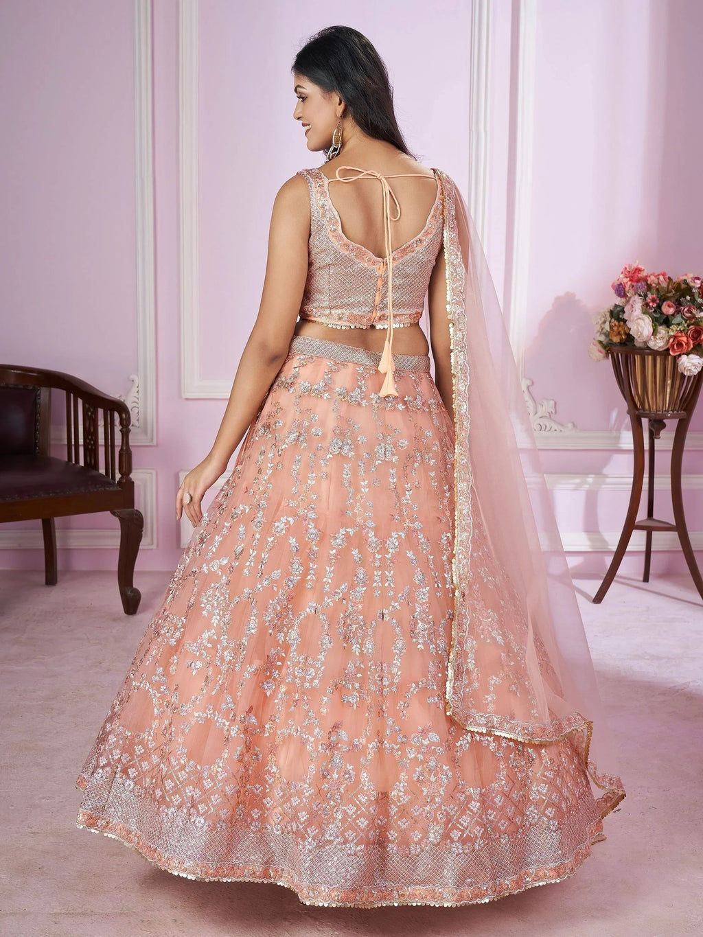 Pretty Peach Sequins Soft Net Engagement Wear Lehenga Choli