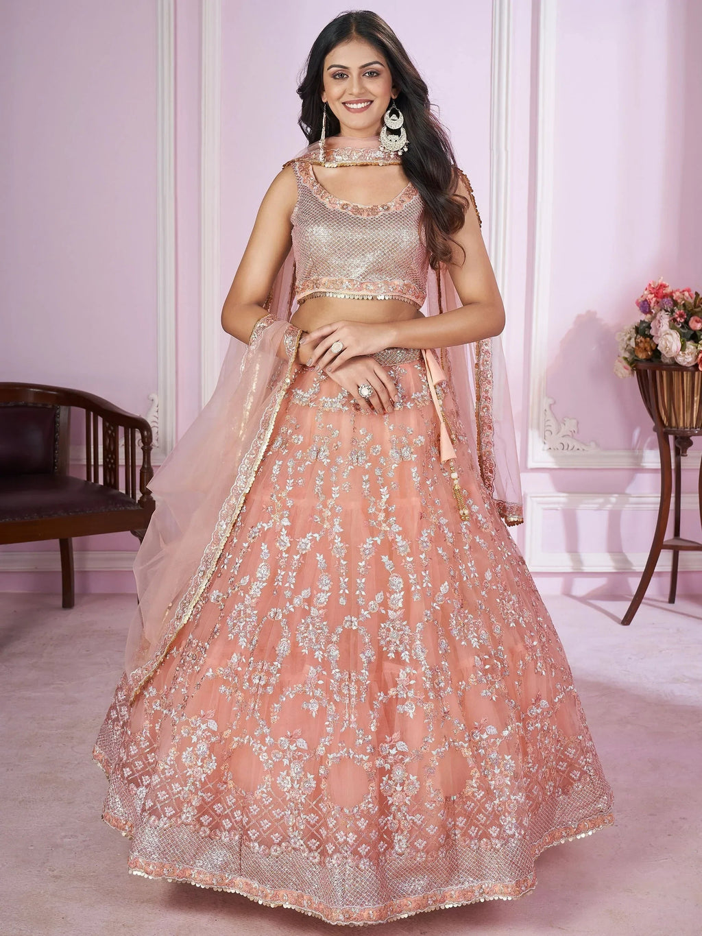 Pretty Peach Sequins Soft Net Engagement Wear Lehenga Choli